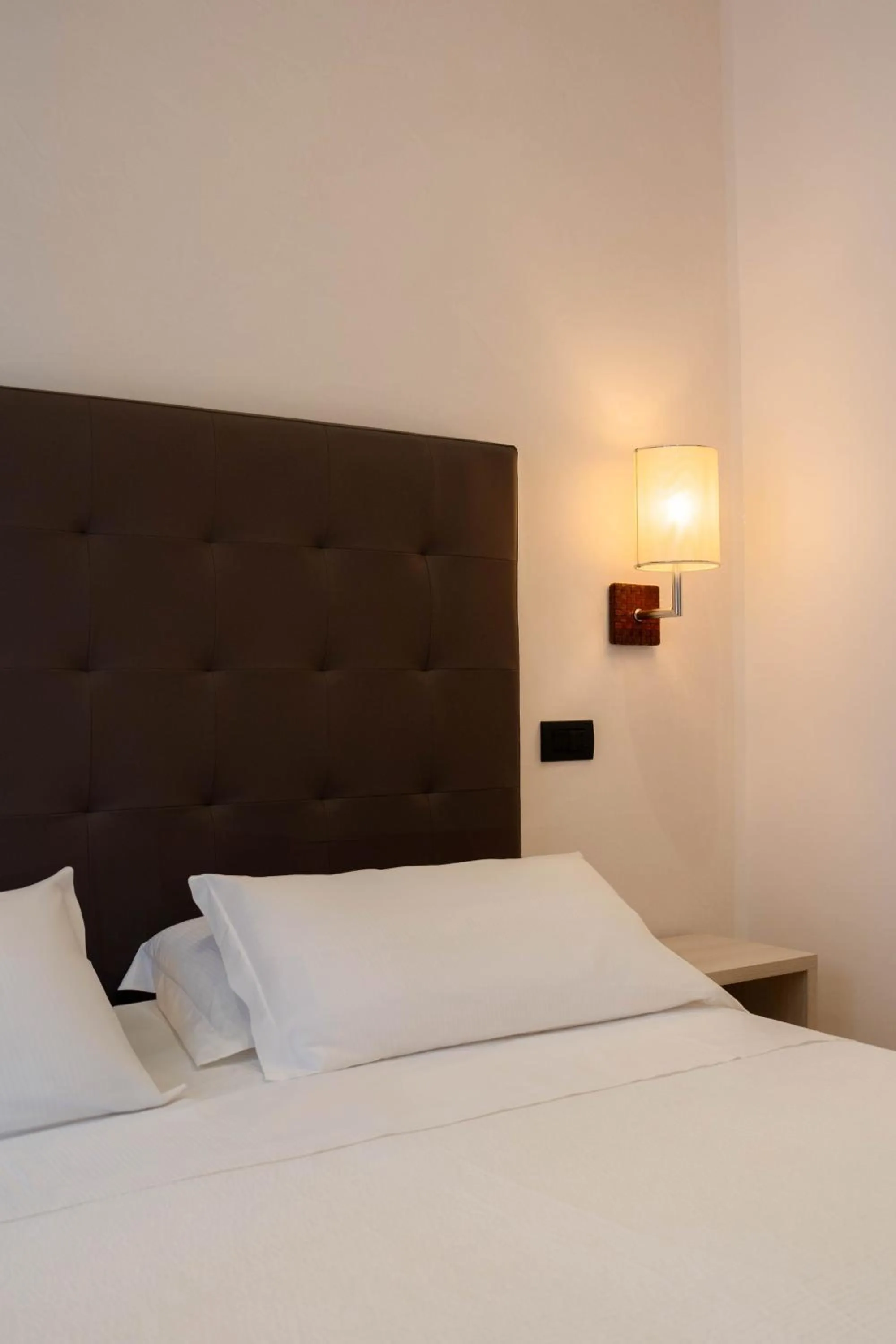 Bed in Hotel Florida Lerici