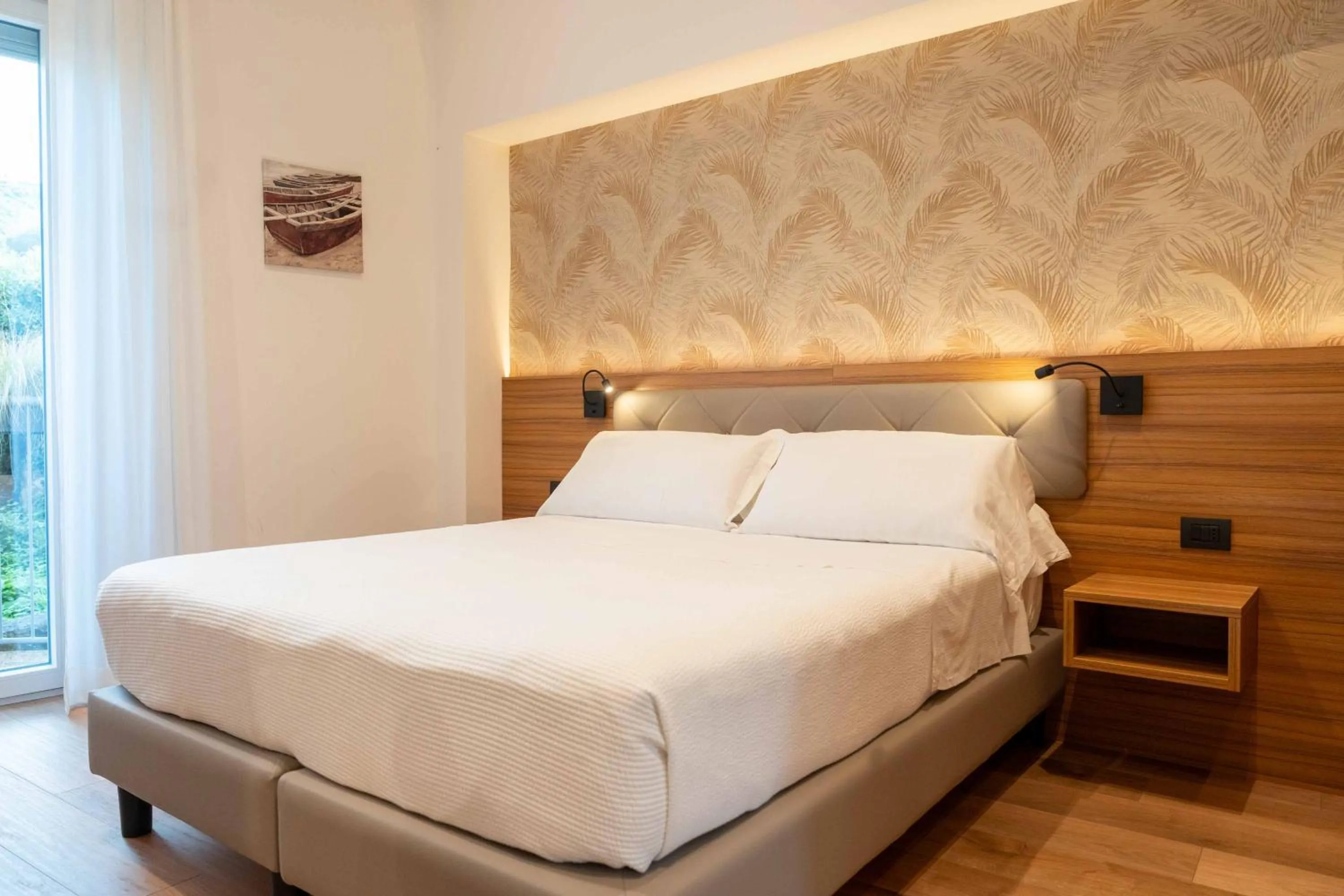 Bed in Hotel Florida Lerici