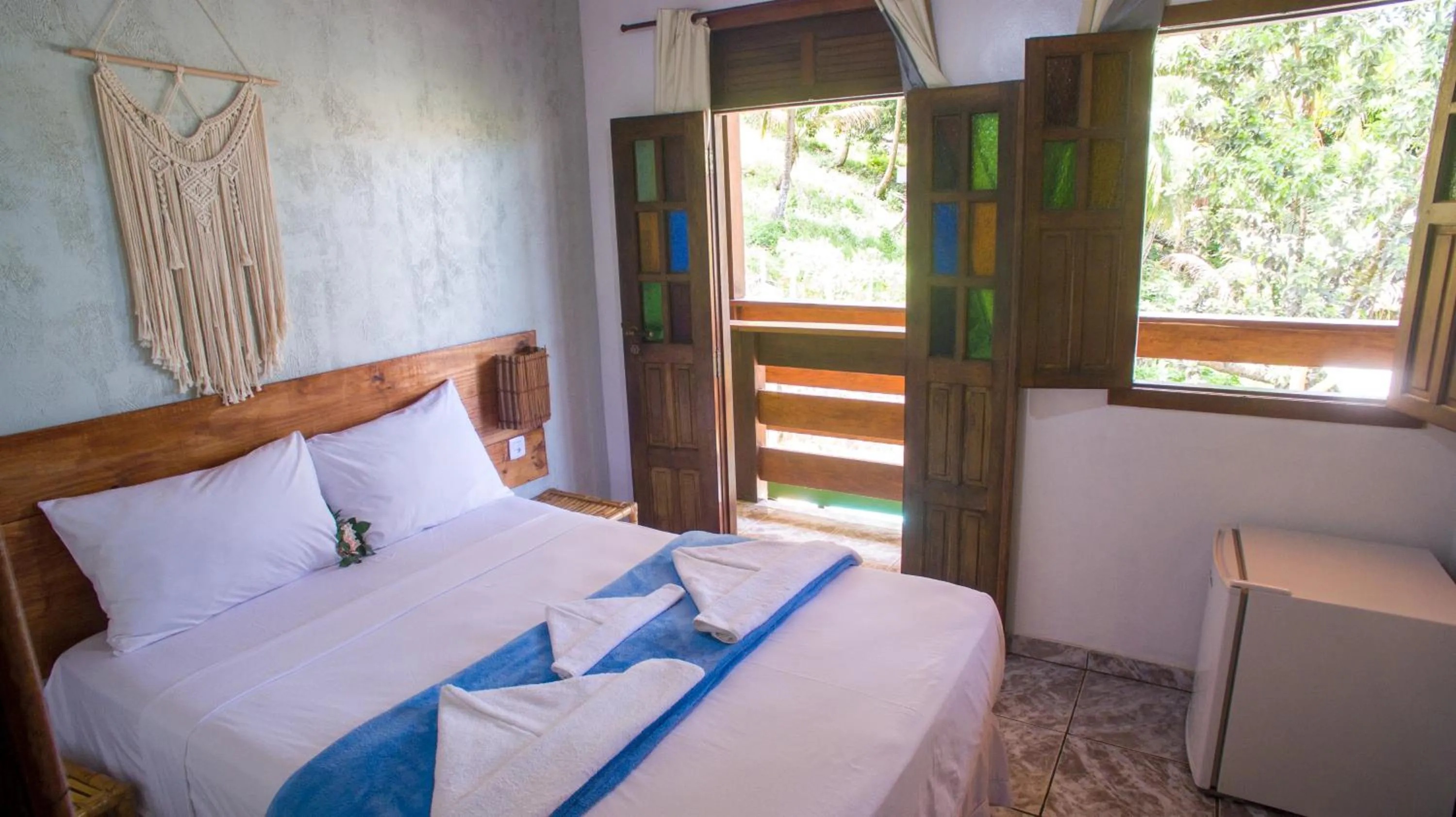 Bed in Pousada Bicho Preguiça