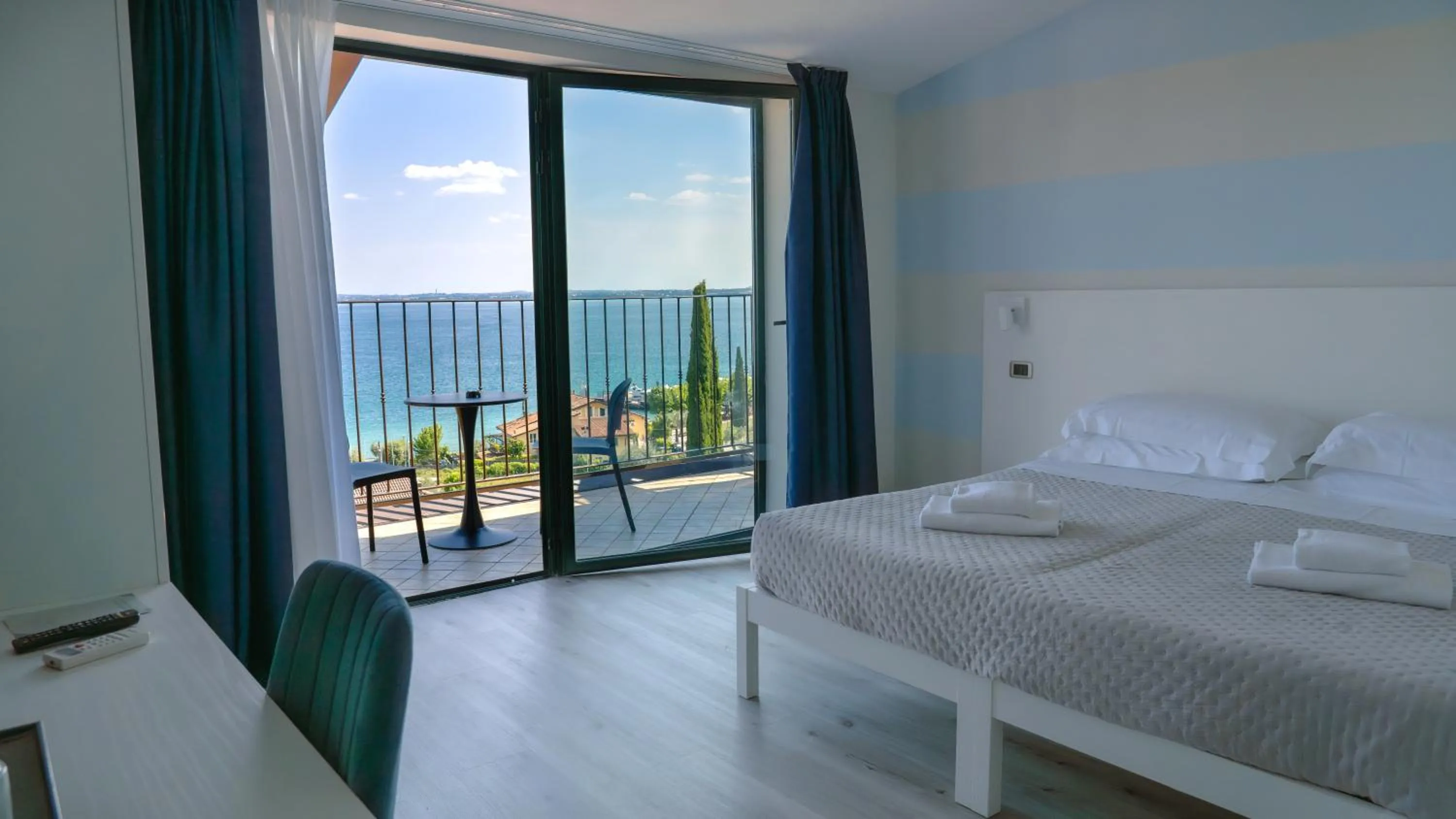 View (from property/room), Bed in AHG Riva Del Sole Hotel - Adults Only