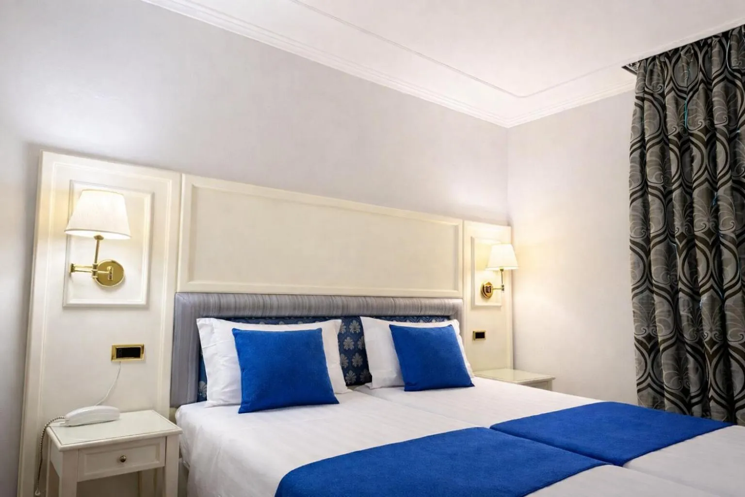 Bed in Hotel President Venezia