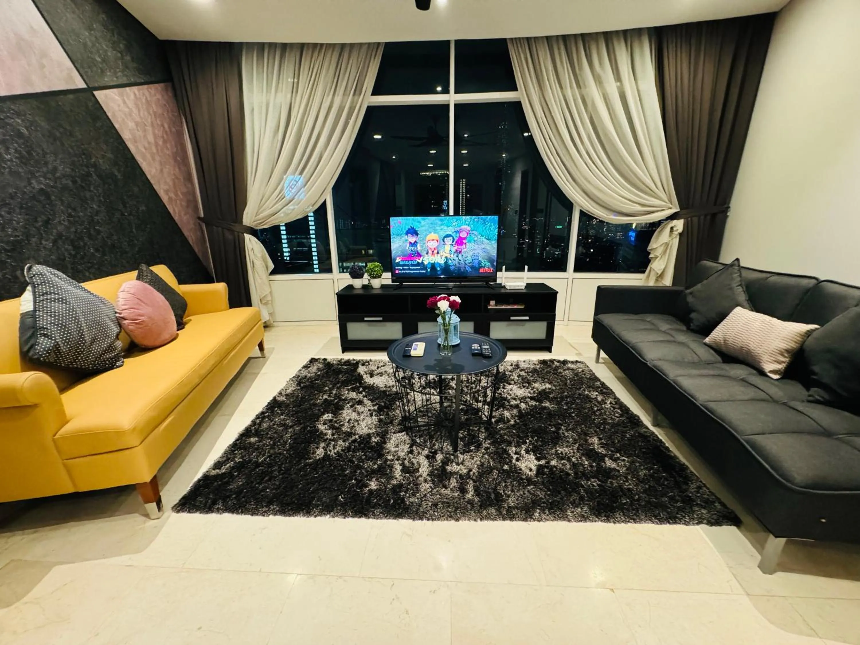 Communal lounge/ TV room in Vortex Suites klcc by Rit