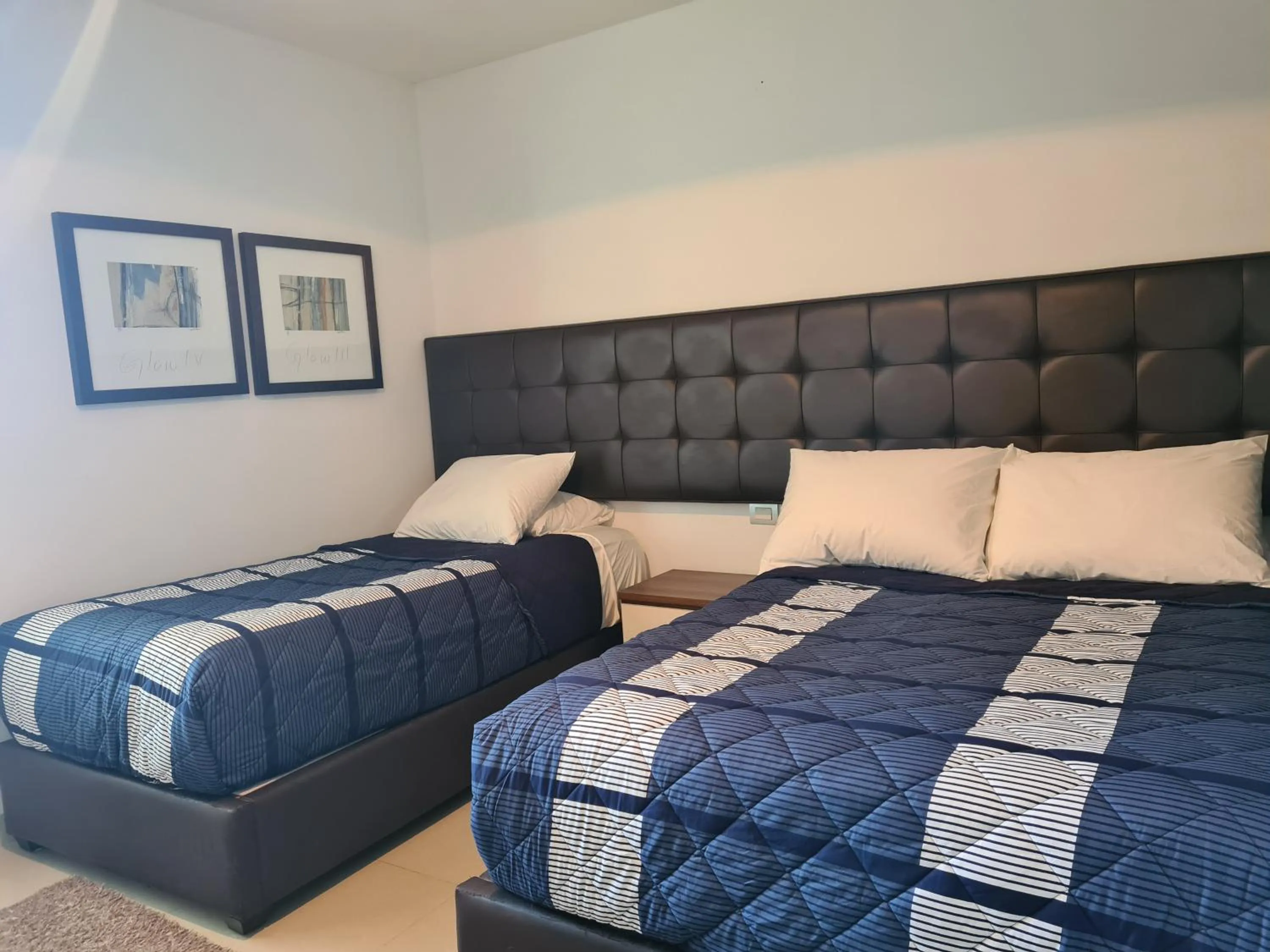 Bed in Luxury ocean view penthouse and private beach club