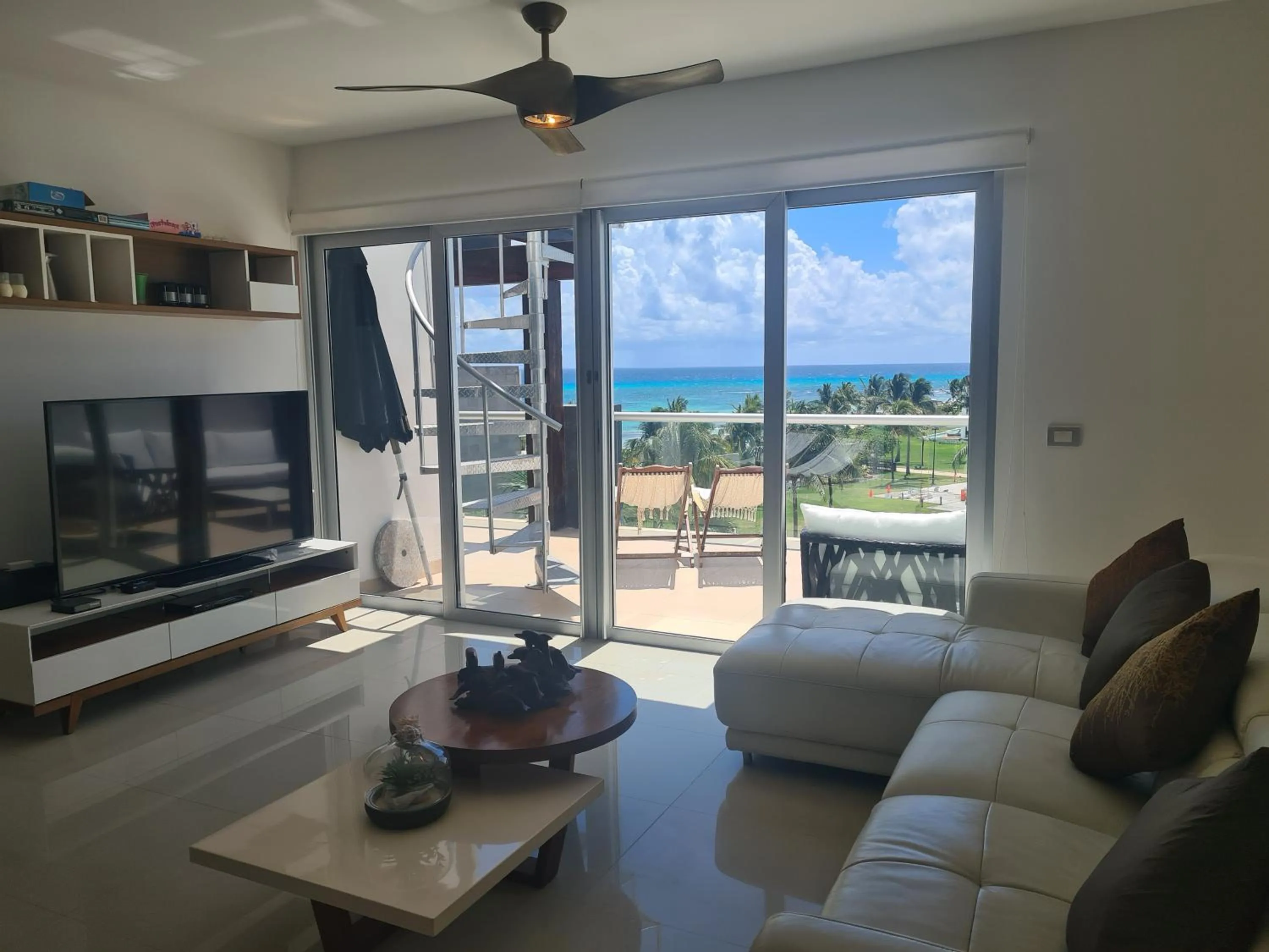 Living room in Luxury ocean view penthouse and private beach club