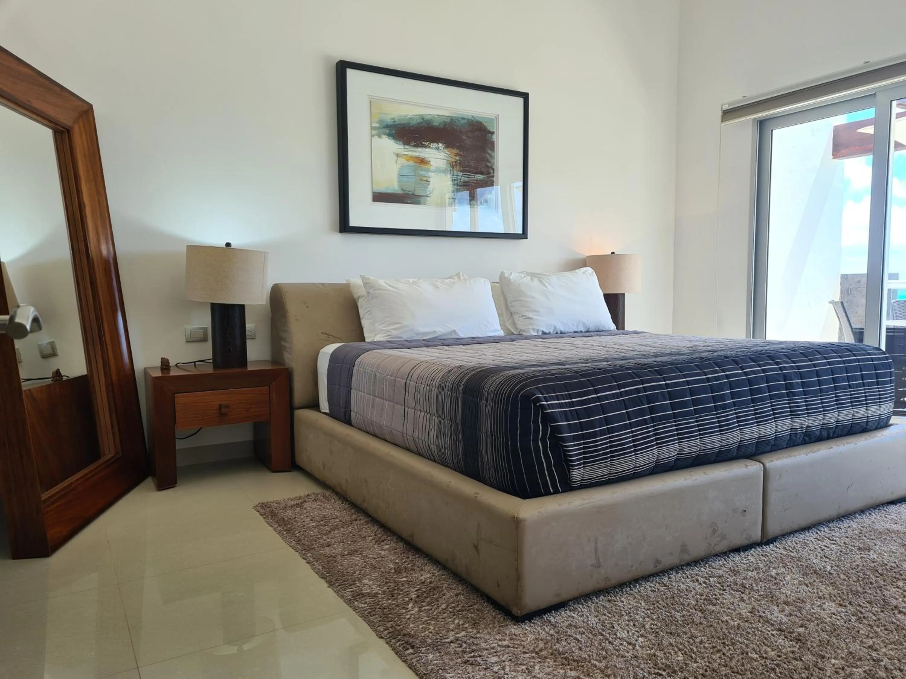 Bed in Luxury ocean view penthouse and private beach club