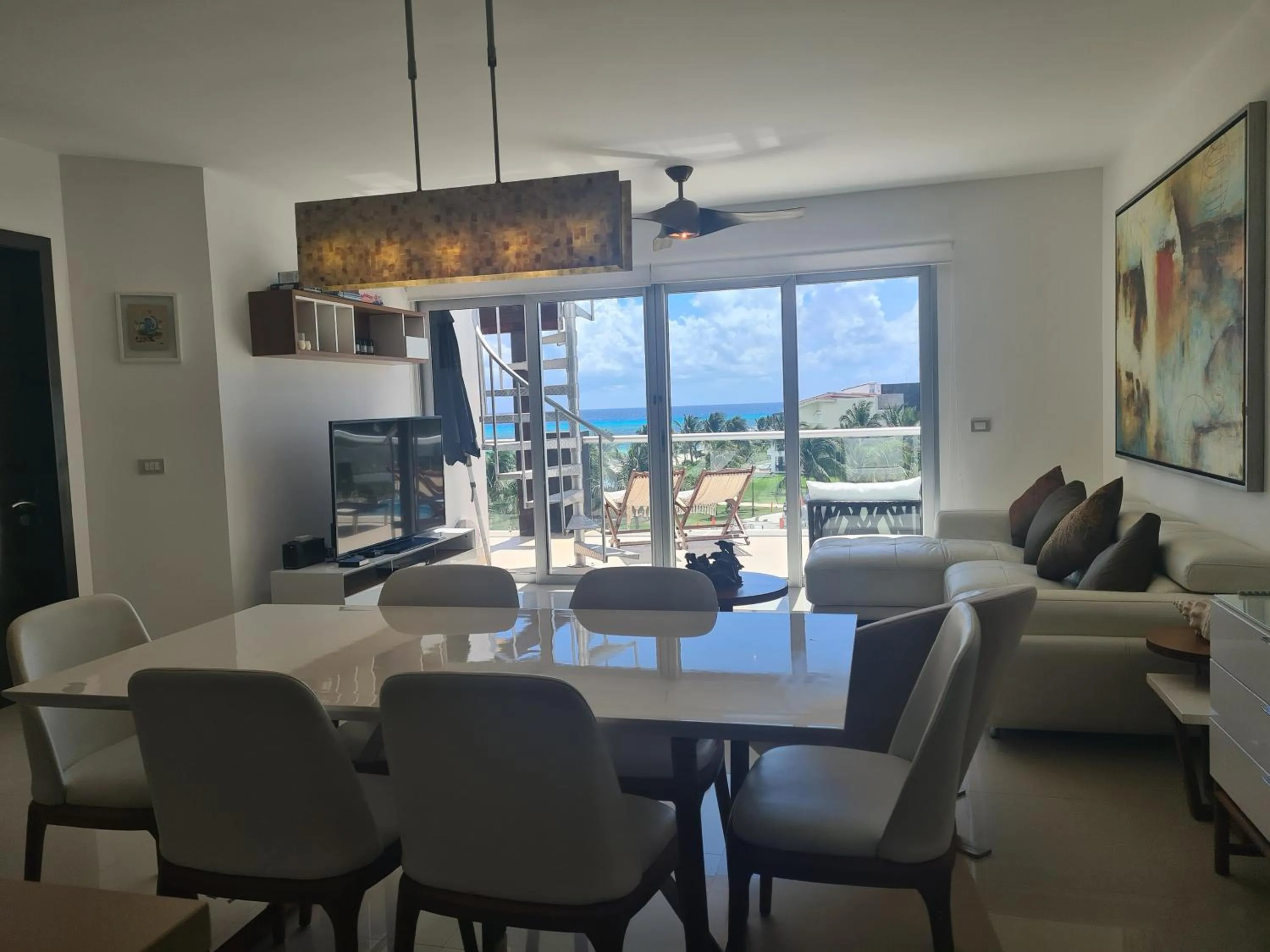 Living room in Luxury ocean view penthouse and private beach club