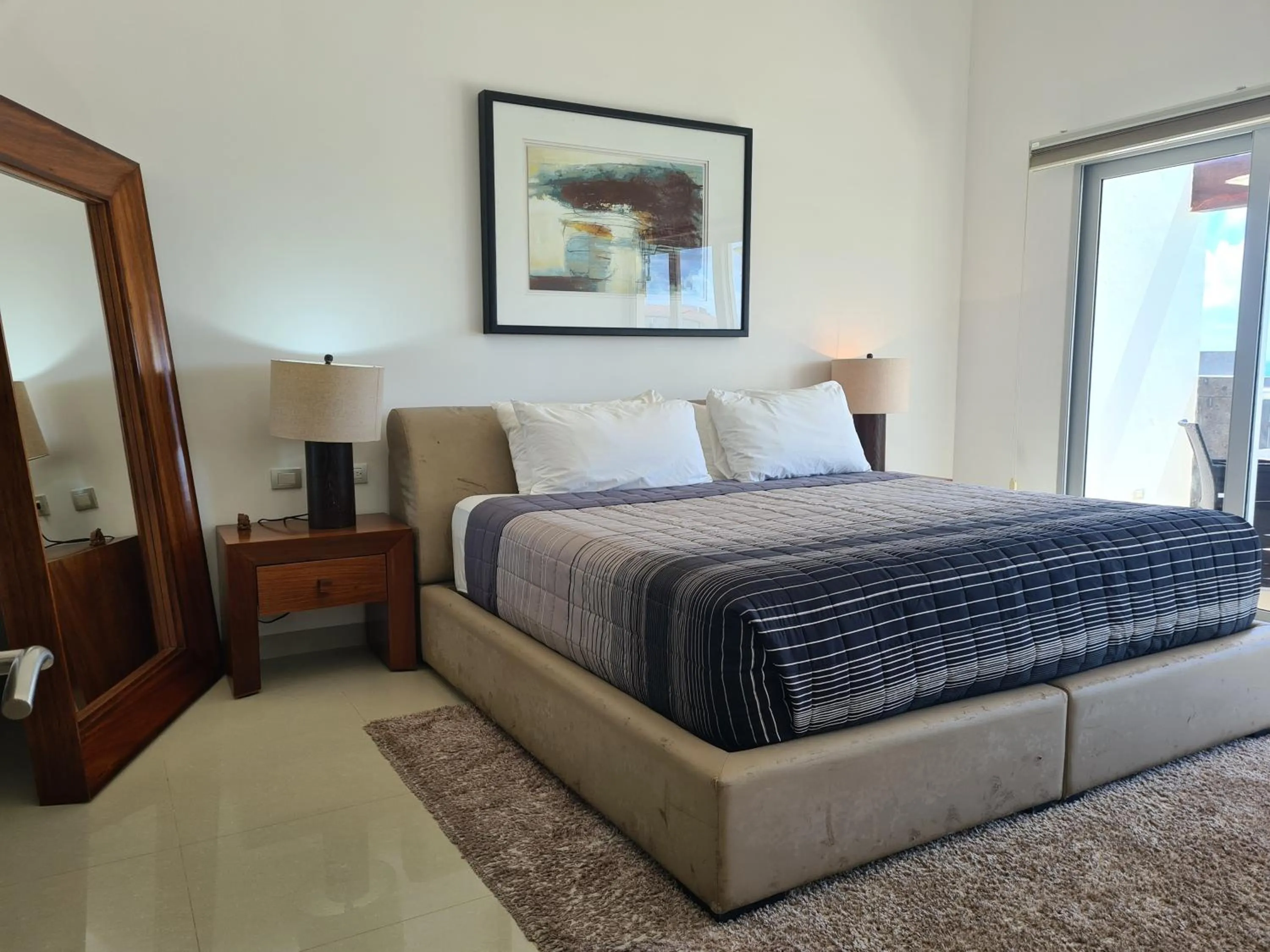 Bed in Luxury ocean view penthouse and private beach club