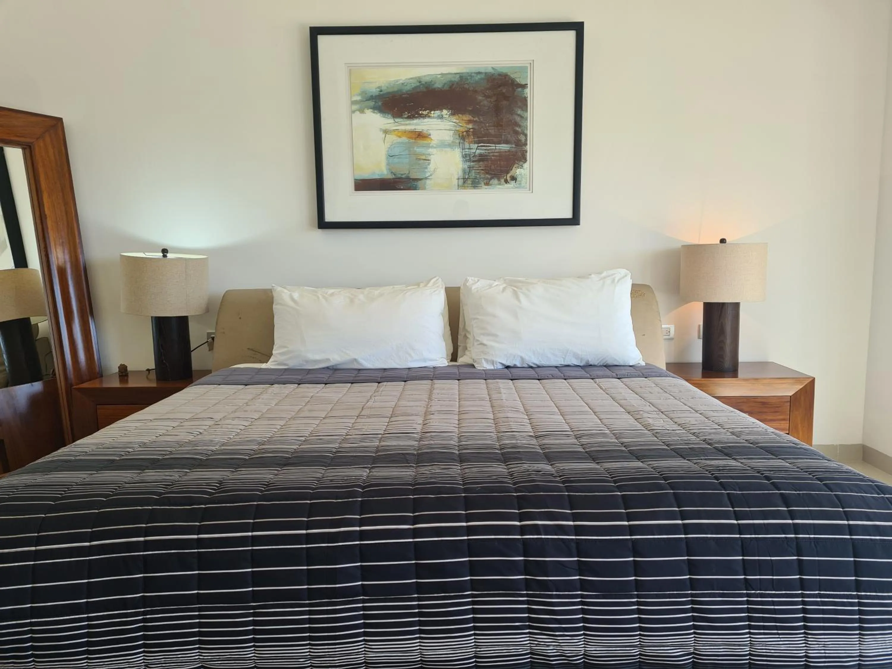 Bed in Luxury ocean view penthouse and private beach club