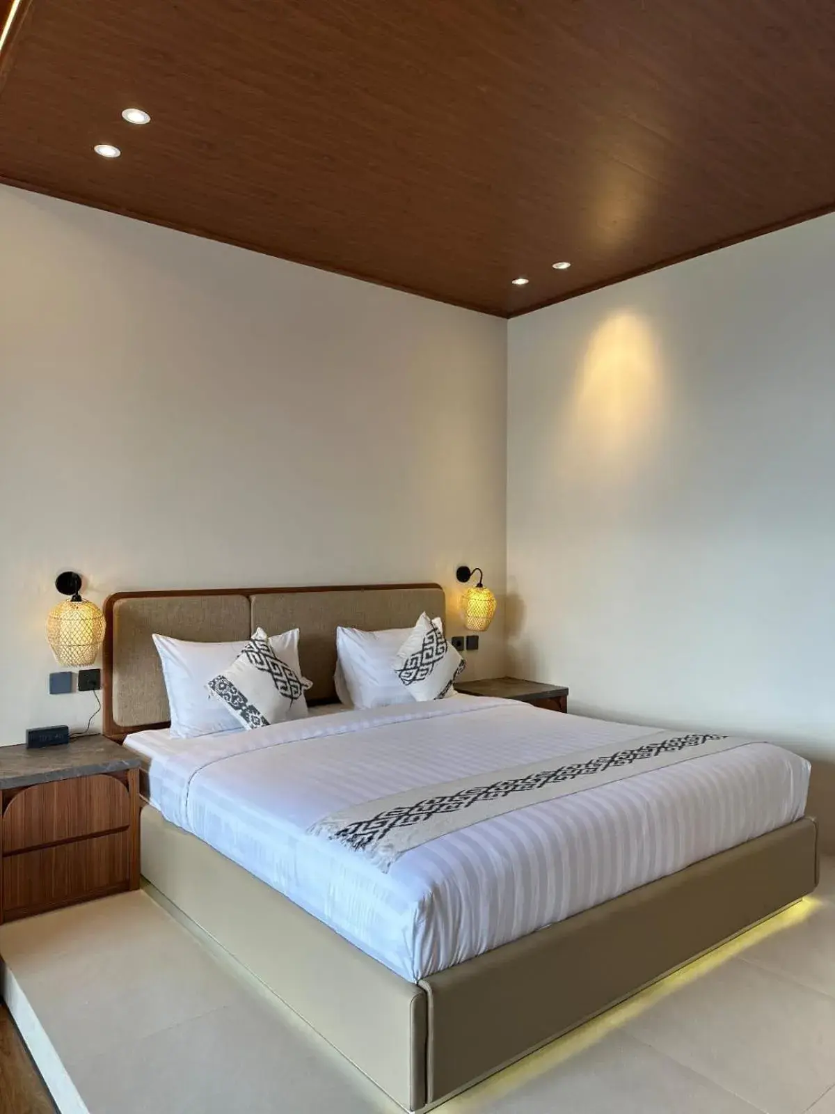 Bed in De Pointé Resort & Resto Bed in De Pointé Resort & Resto