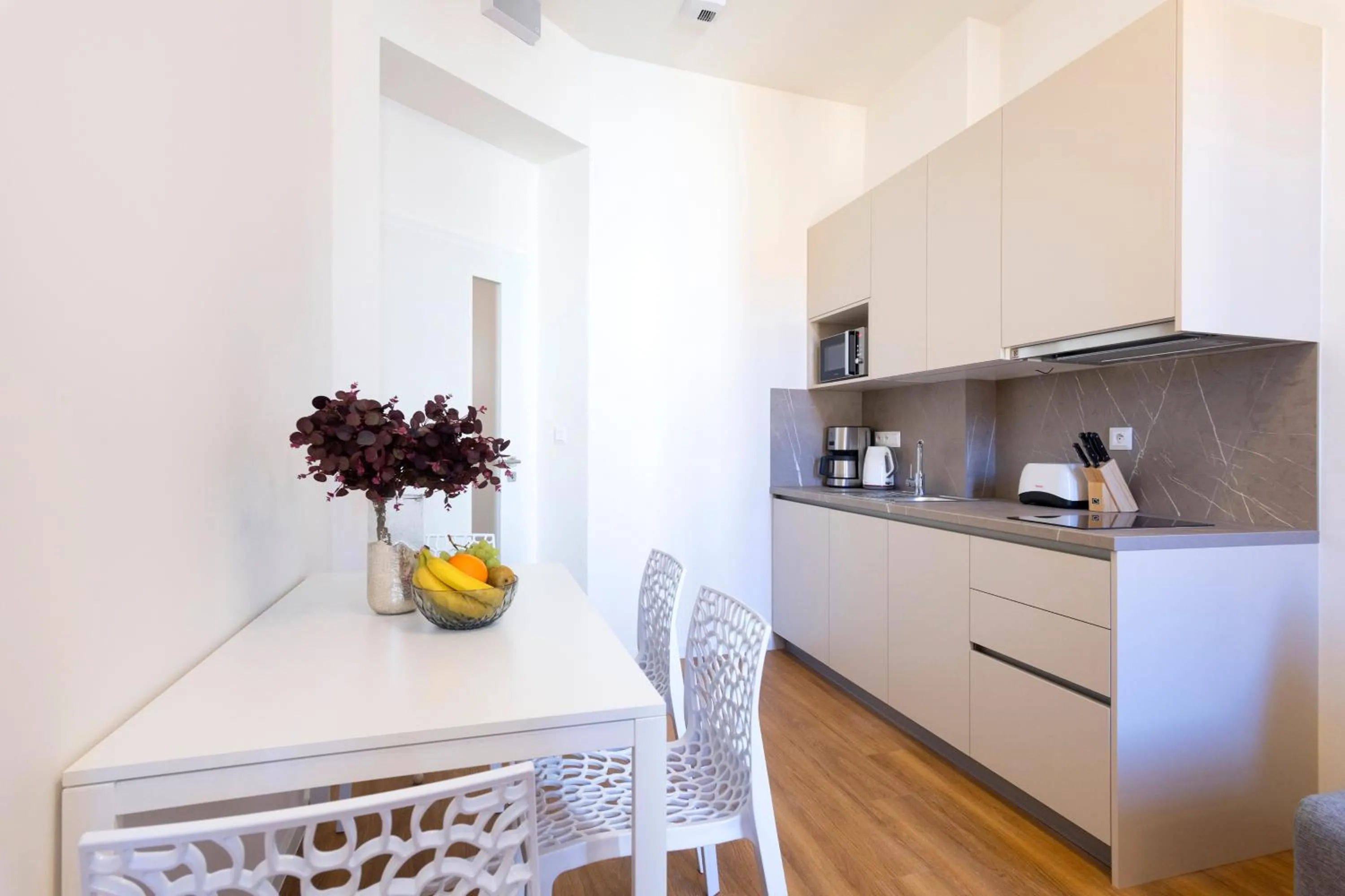 Kitchen or kitchenette in Hidden Art Boutique Residence by Dwellfort