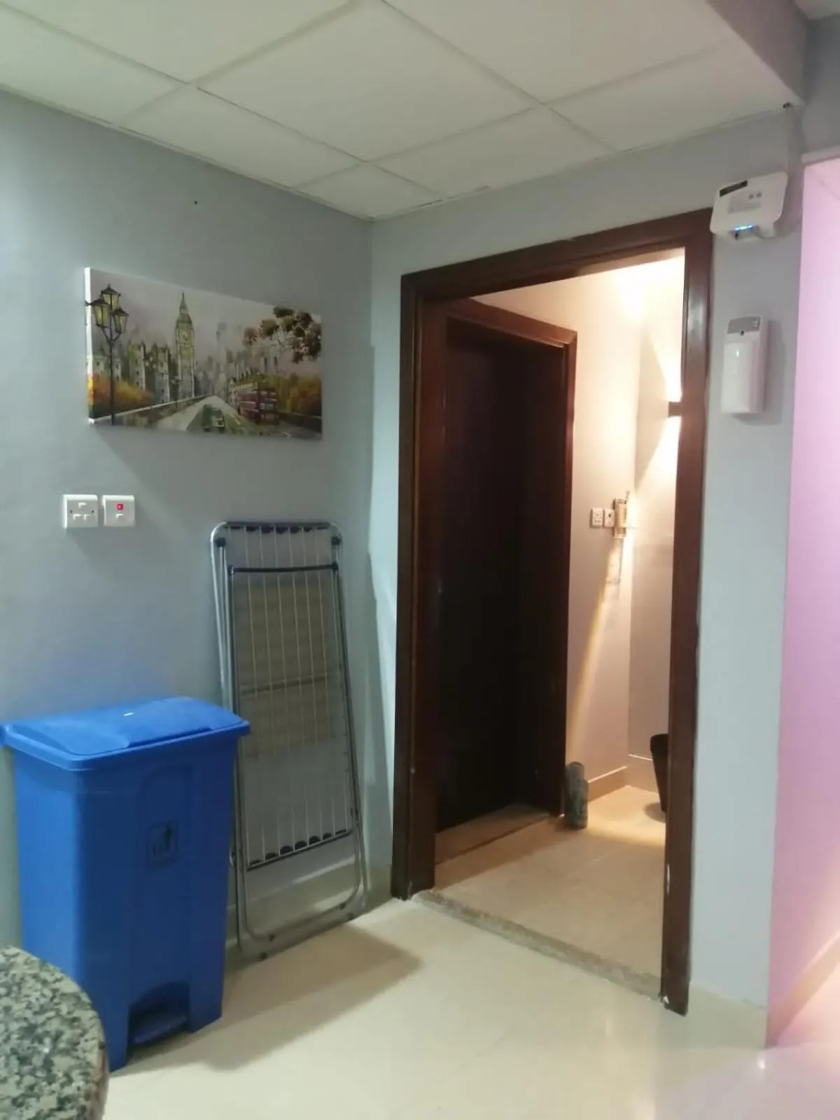 Communal lounge/ TV room in AlBarsha 1 Hostel by PHM