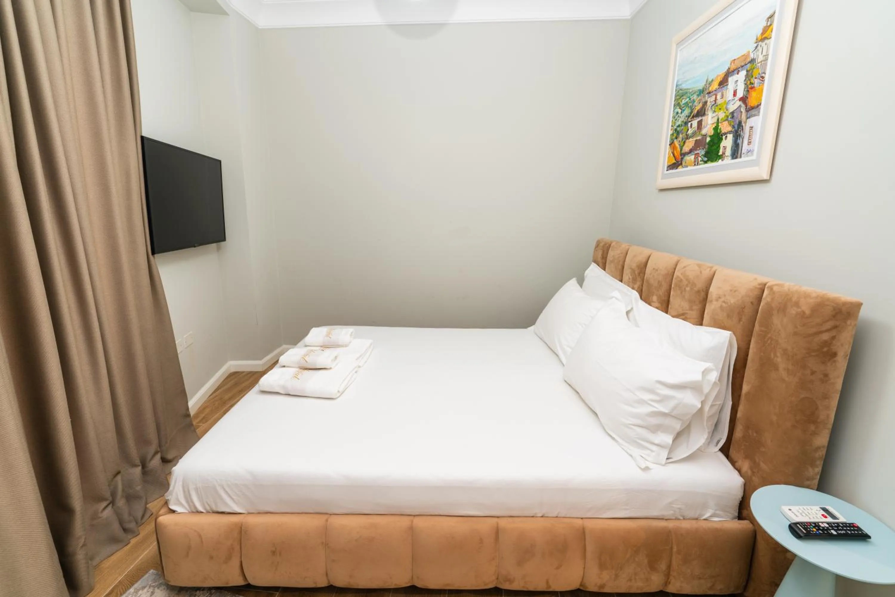 Bed in Blissful Apartments