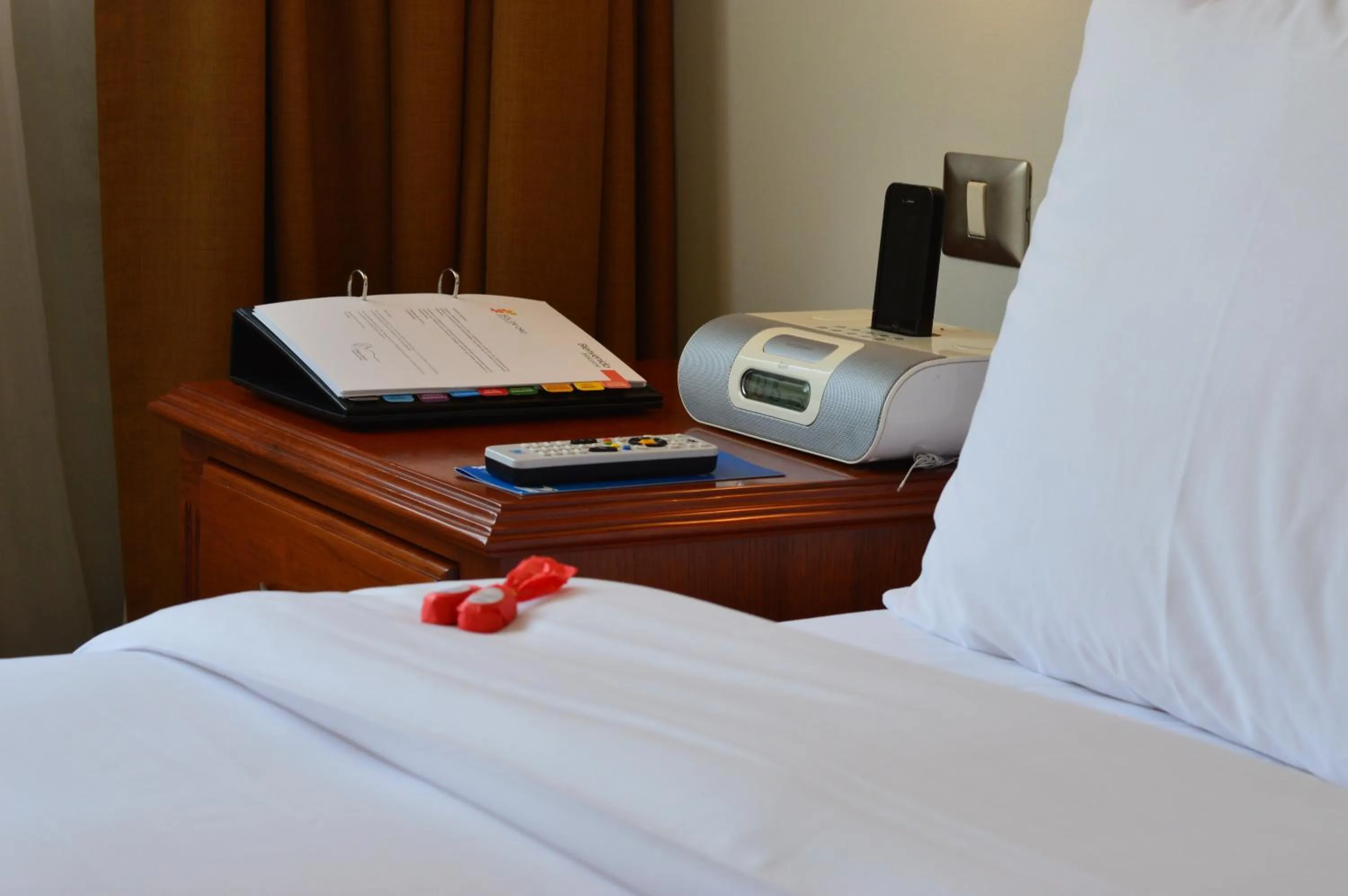 Bed in Sol de Oro Hotel & Suites