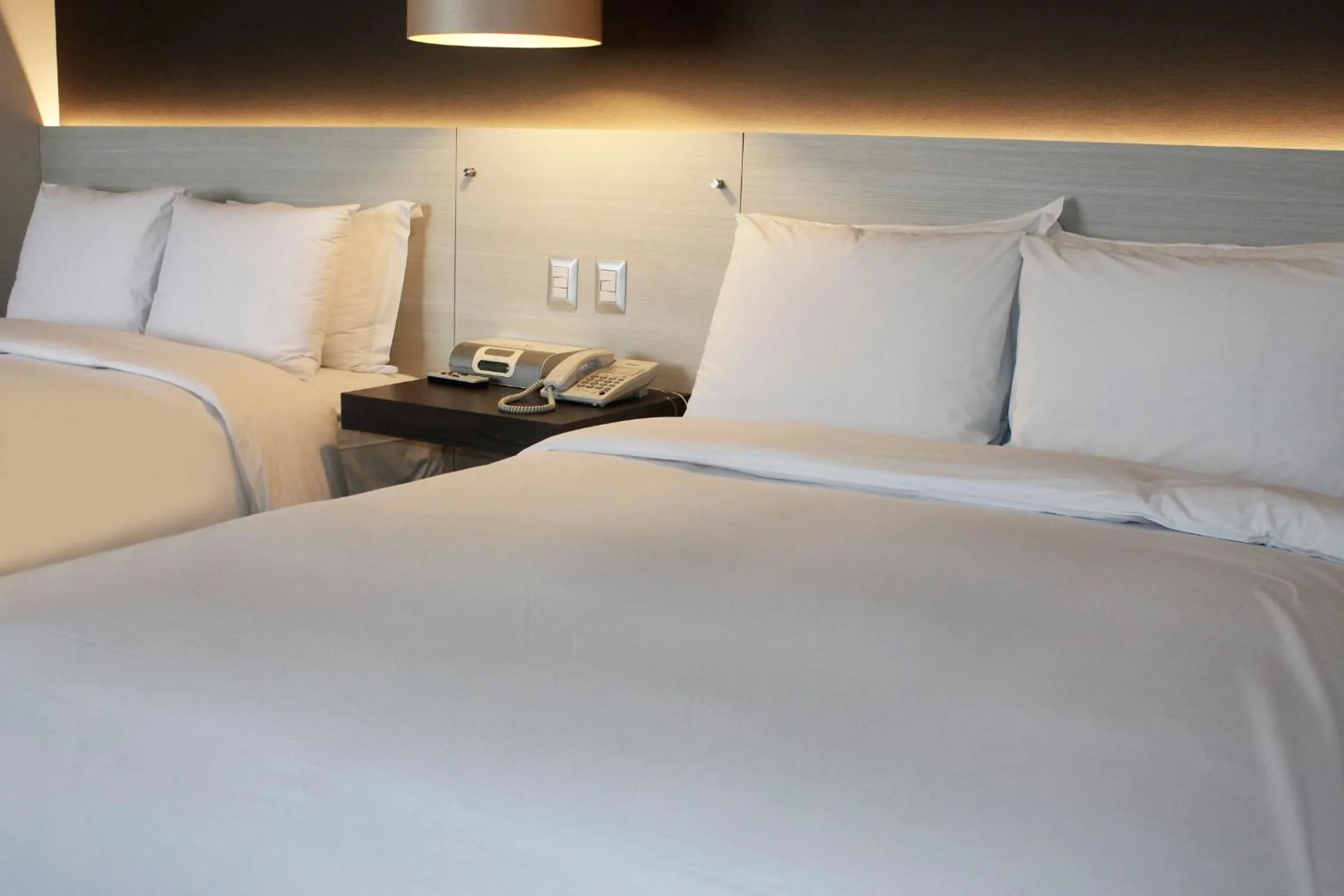 Bed in Sol de Oro Hotel & Suites