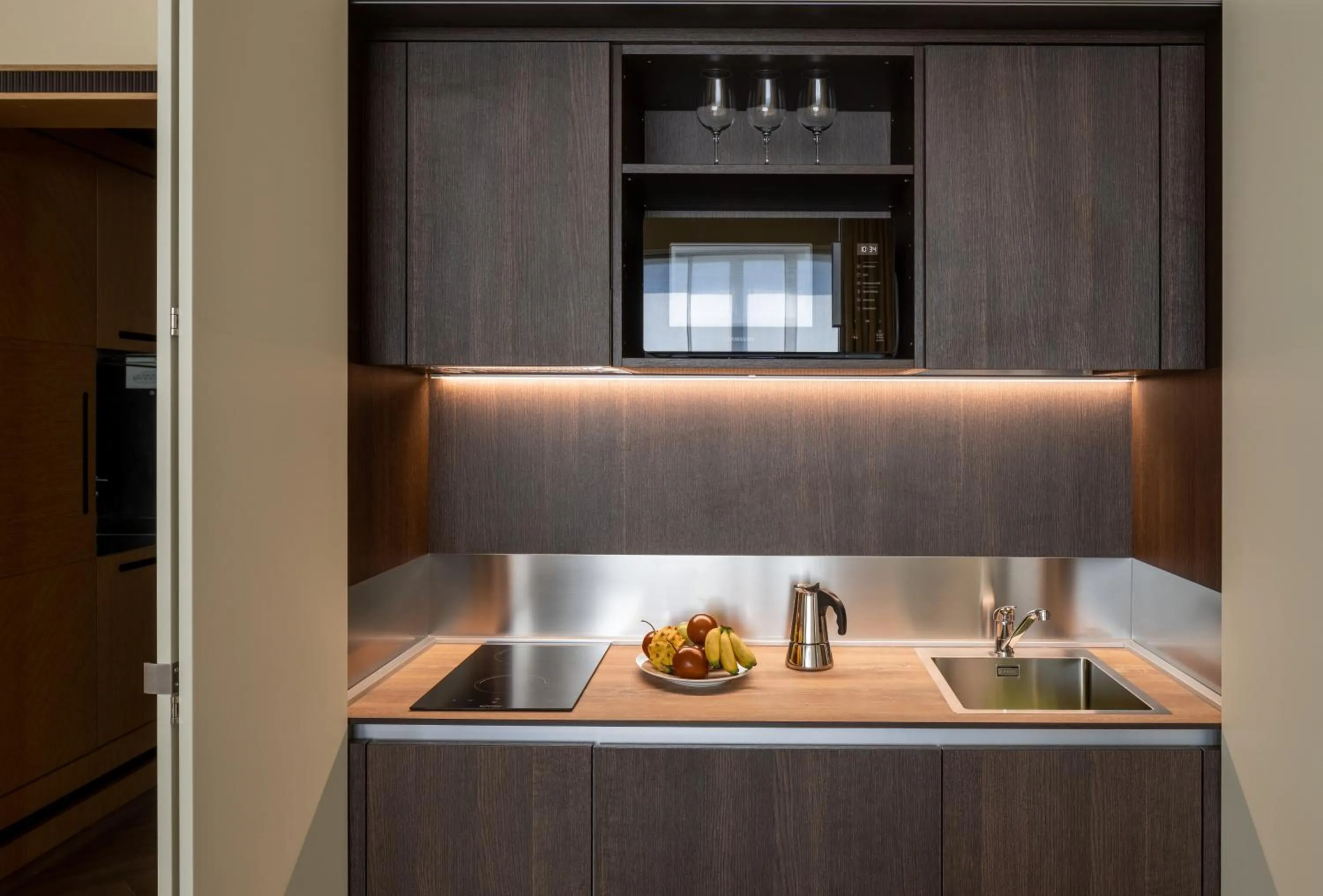 Kitchen or kitchenette in UNA Hotels Malpensa