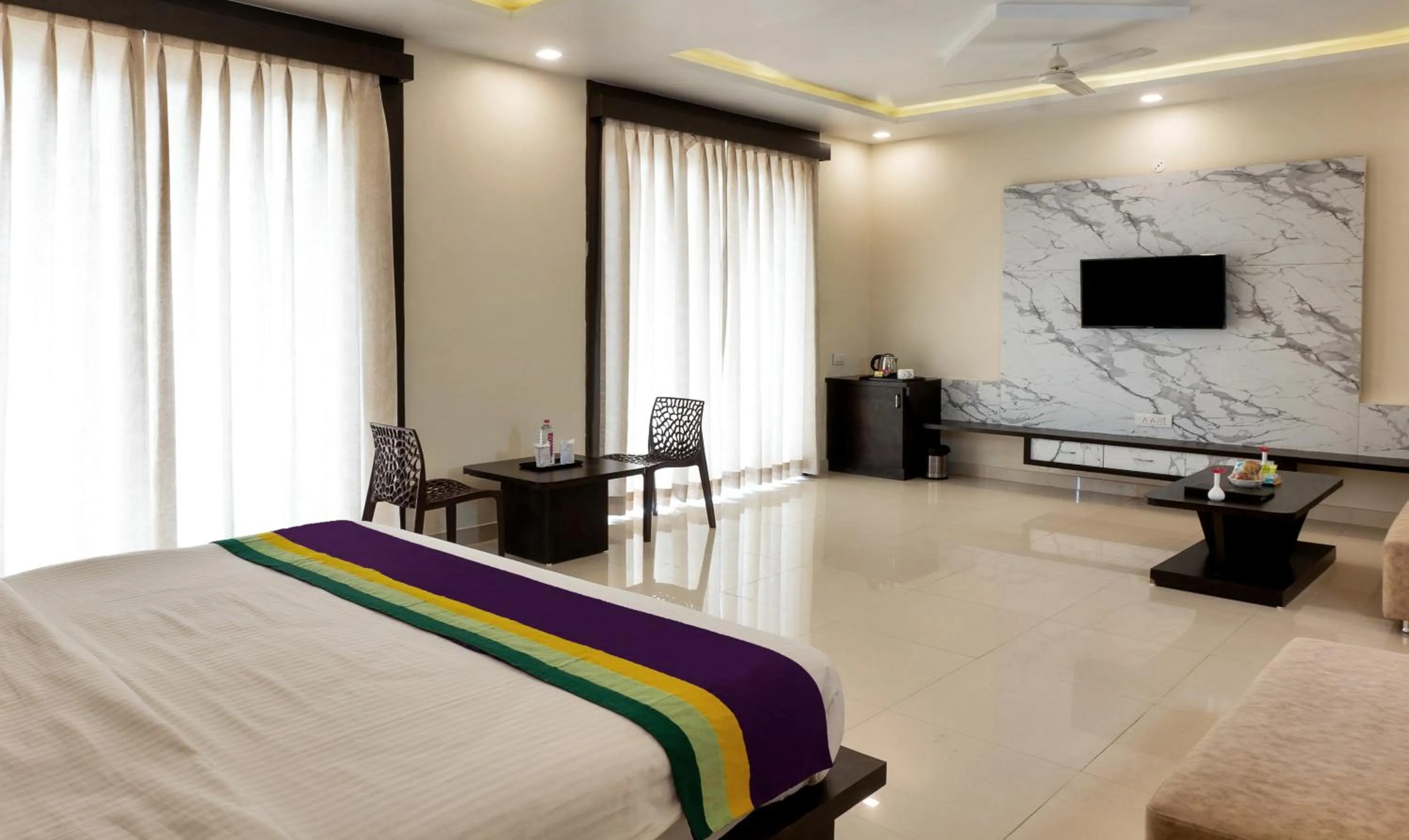 Bedroom, Bed in Treebo Premium Royal Amar With Mountain View and Swimming Pool