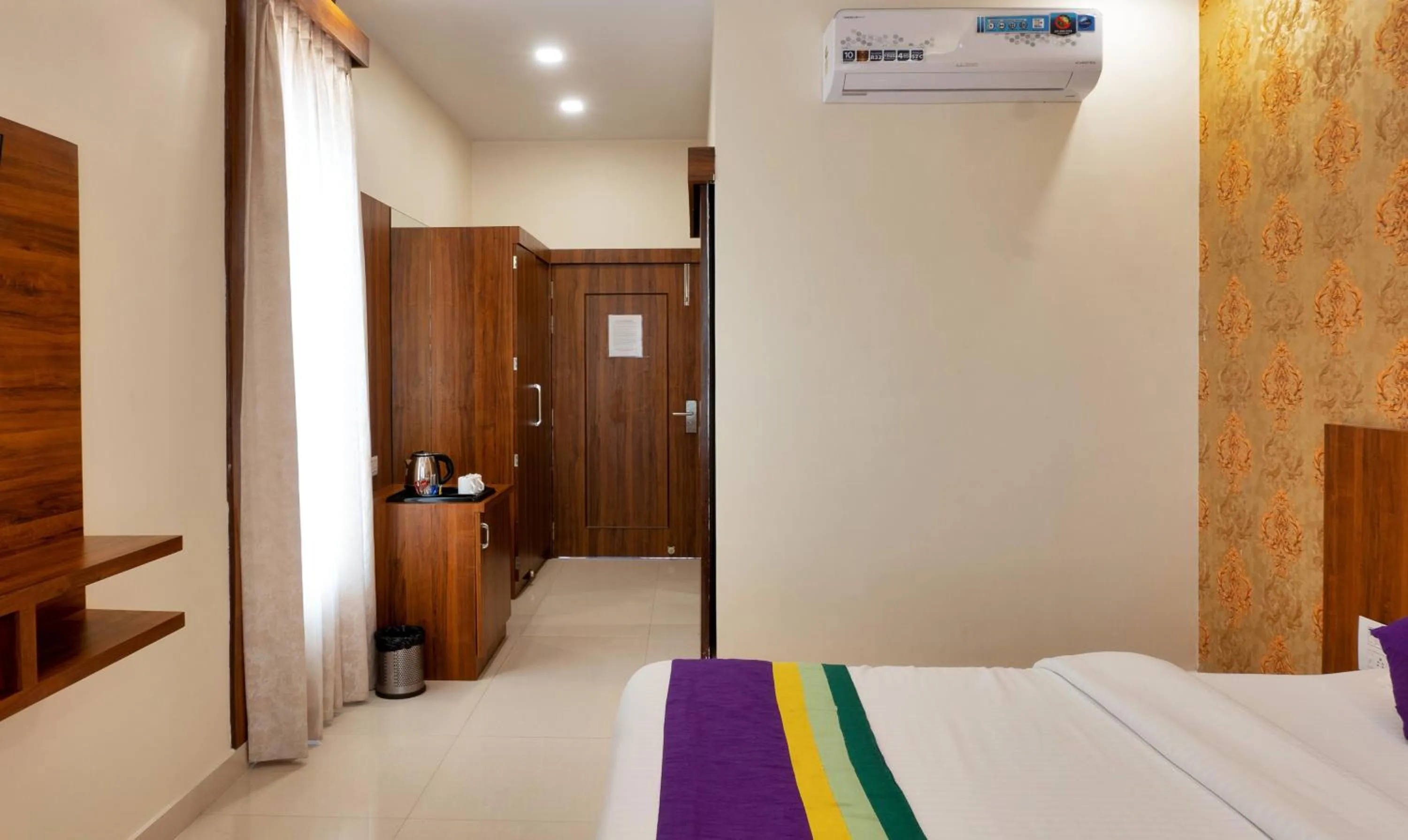 Bed in Treebo Premium Royal Amar With Mountain View and Swimming Pool