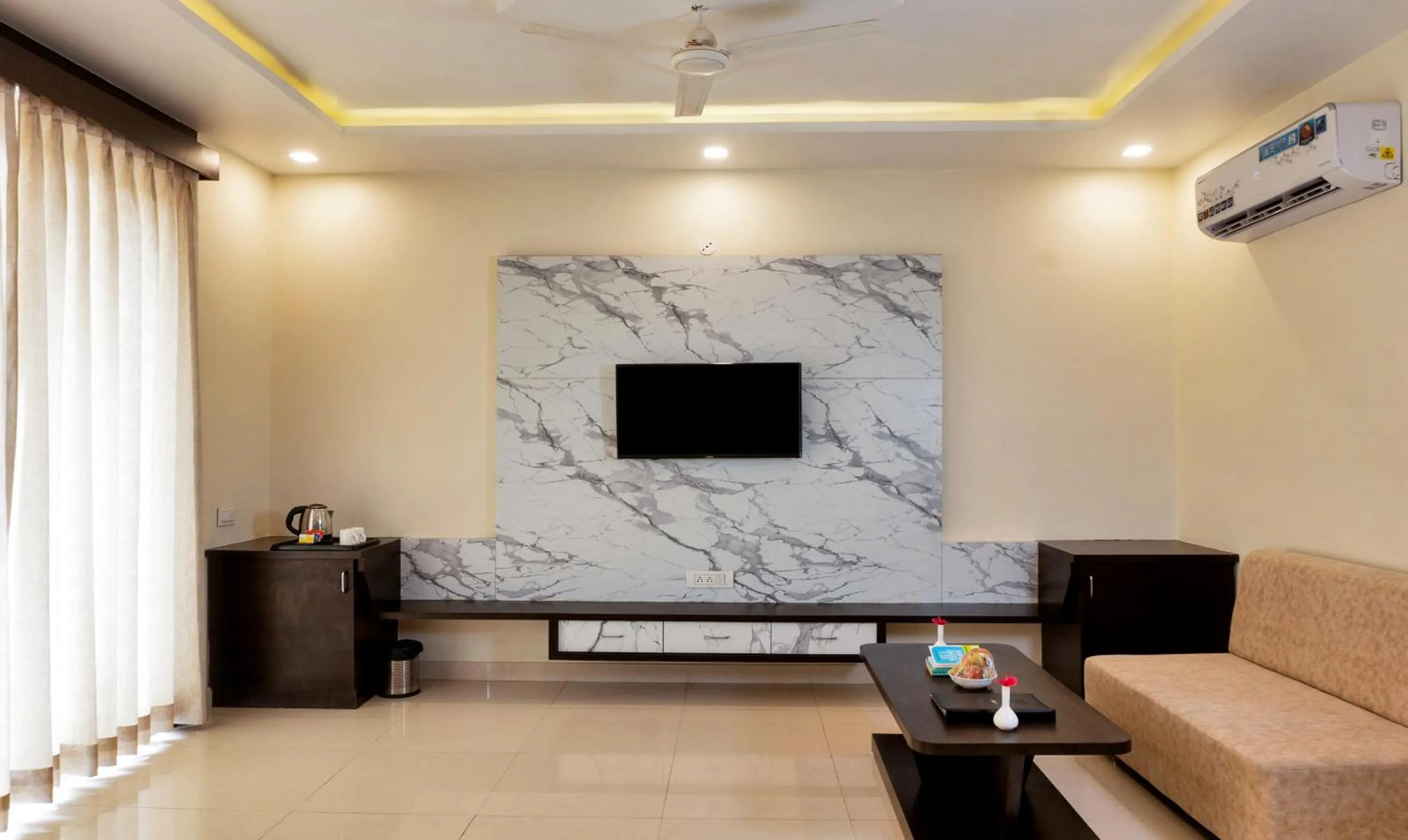 TV and multimedia in Treebo Premium Royal Amar With Mountain View and Swimming Pool