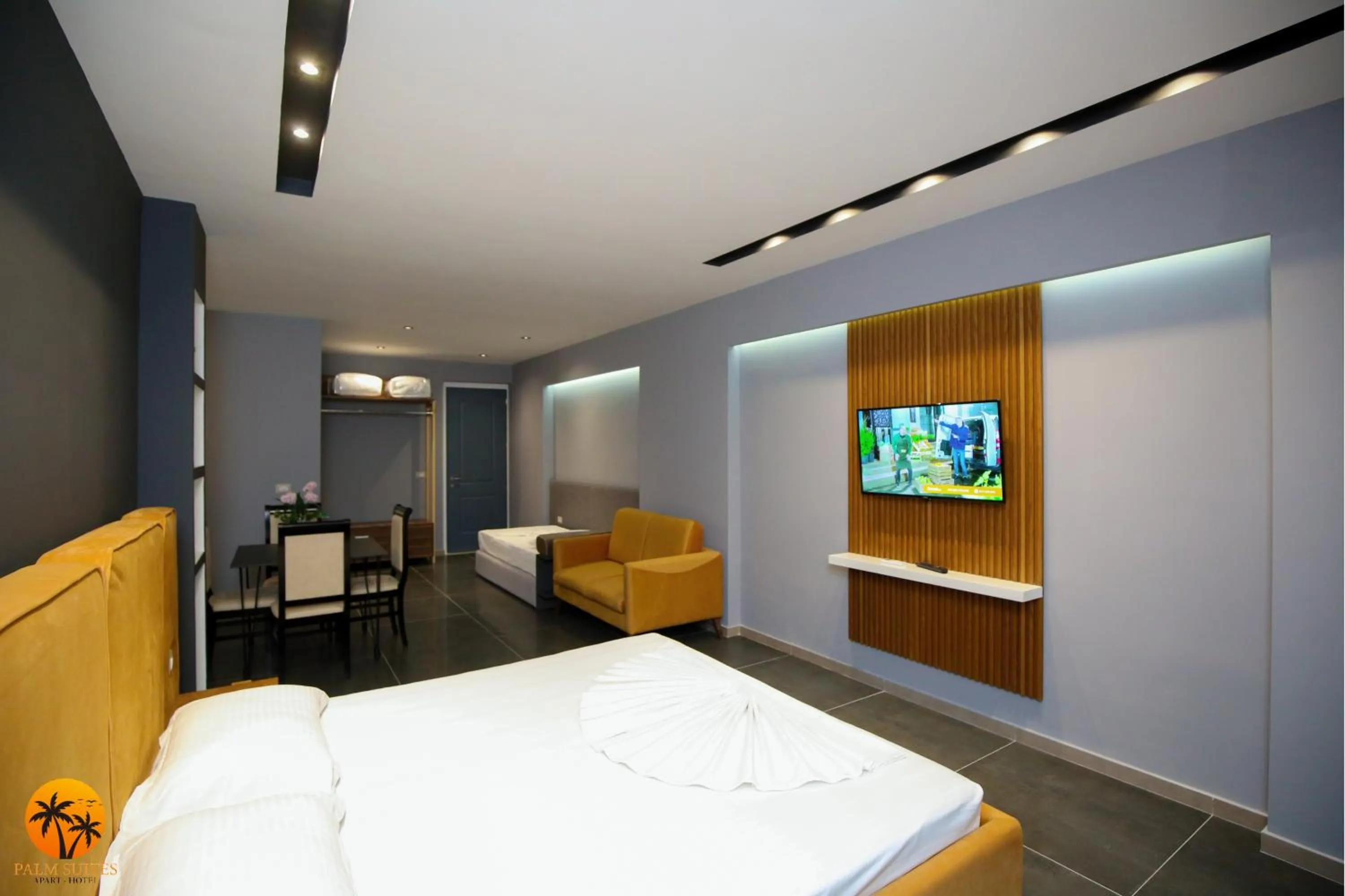 Bed in Palm Suites Apartment-Suite