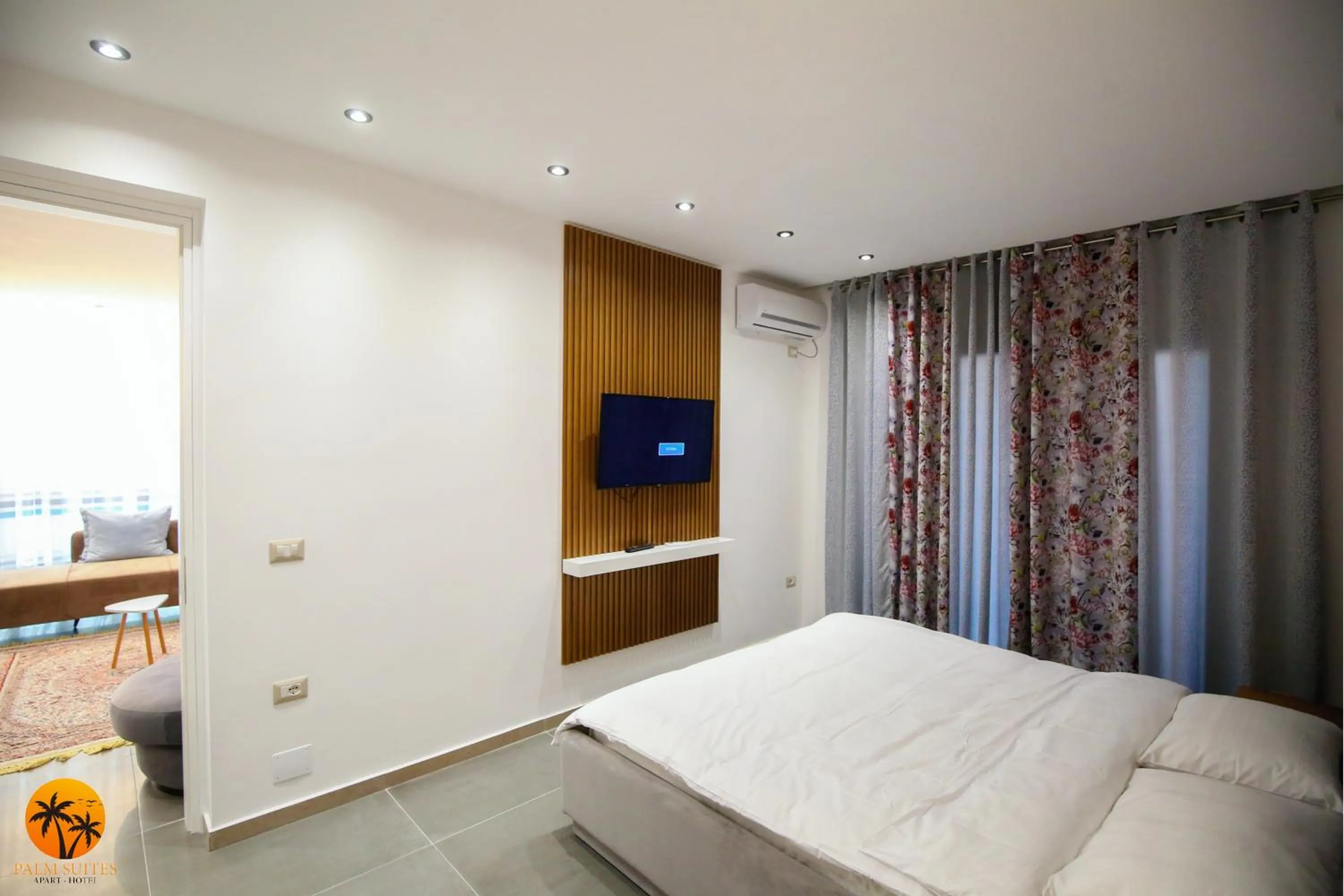 Bed in Palm Suites Apartment-Suite