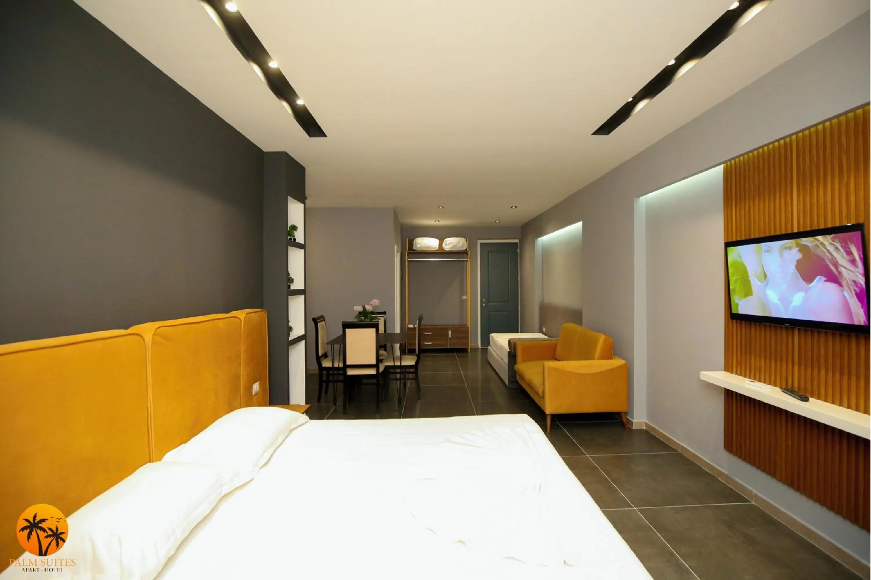 Bed in Palm Suites Apartment-Suite