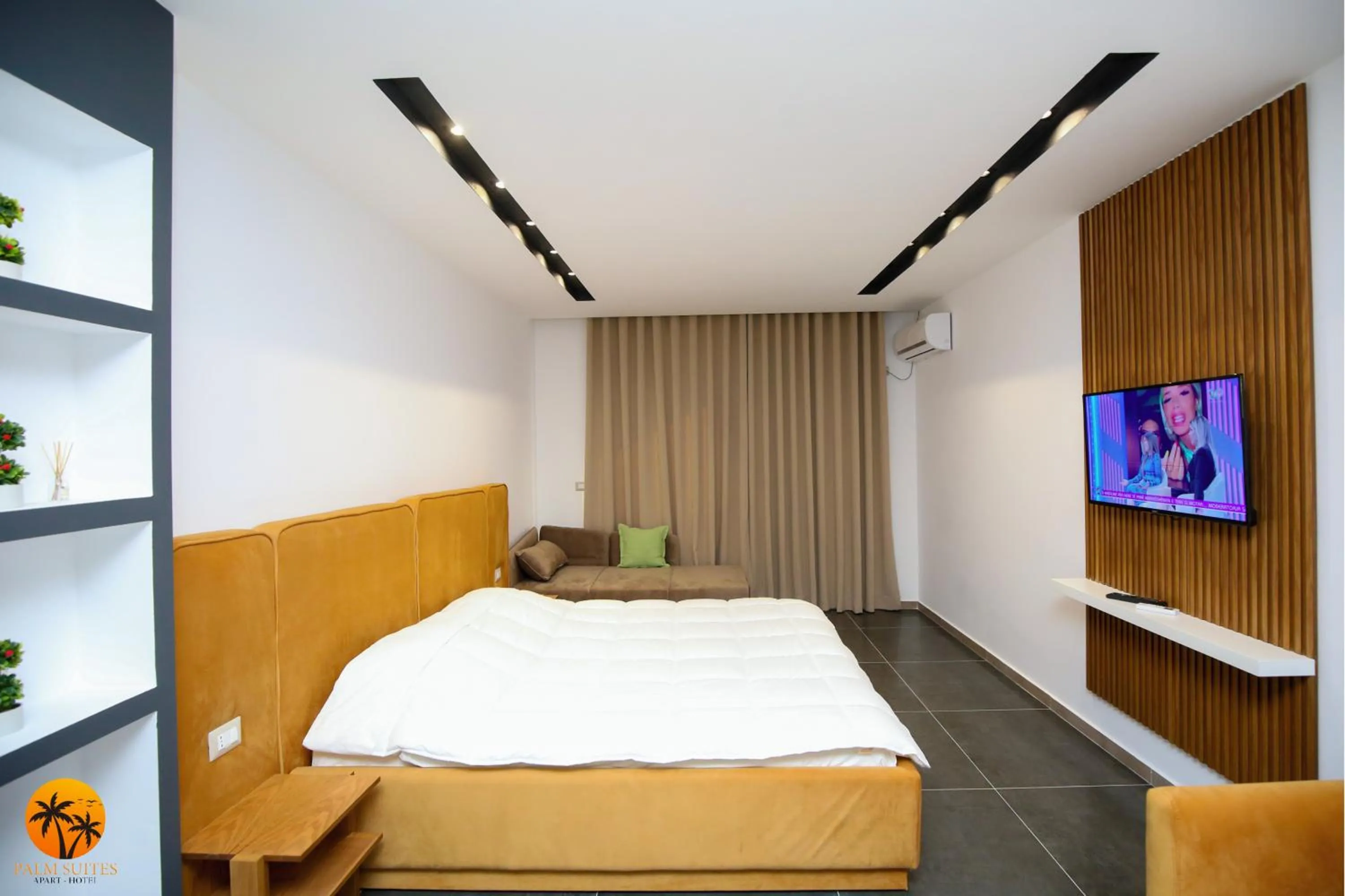 Bed in Palm Suites Apartment-Suite