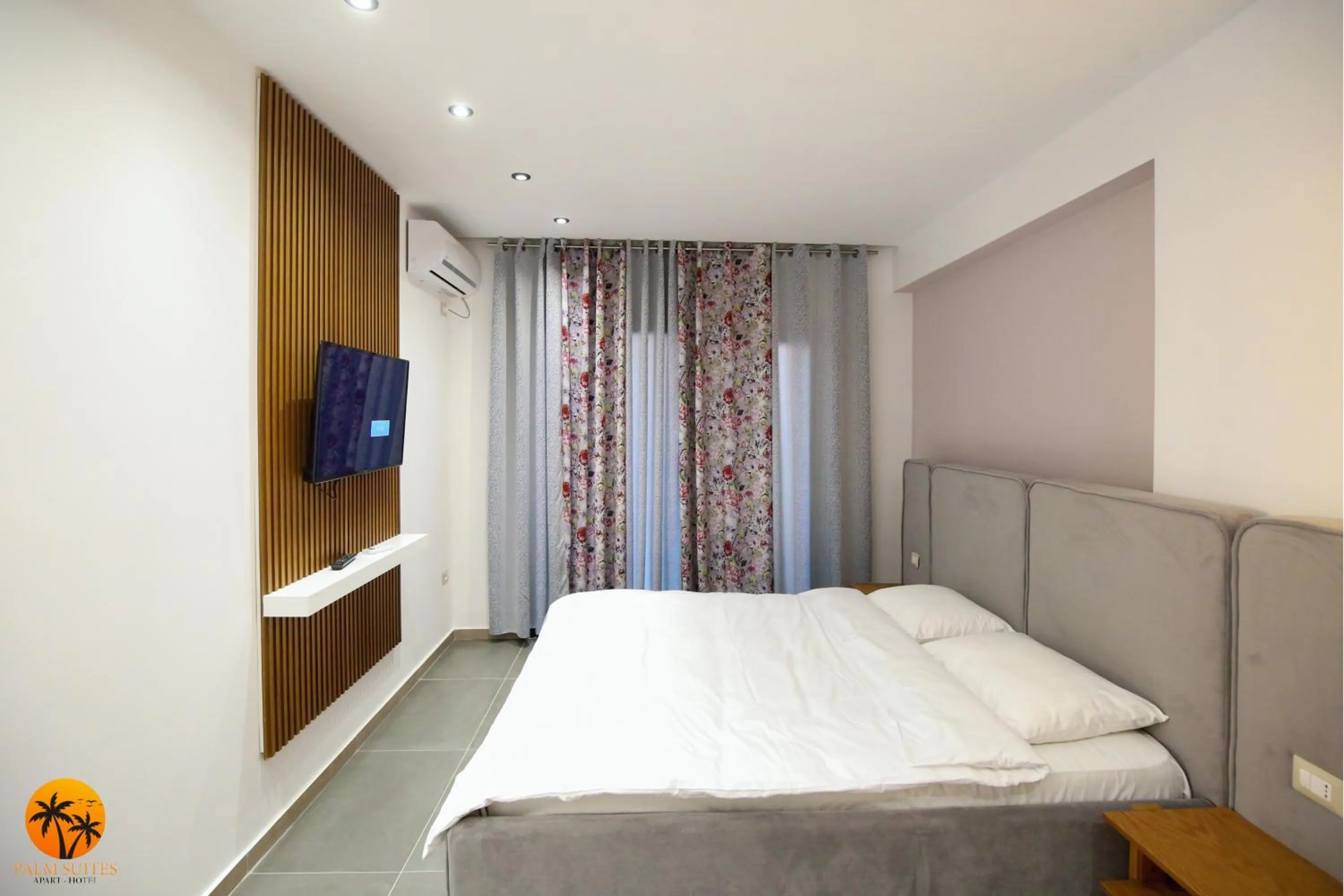 Bed in Palm Suites Apartment-Suite