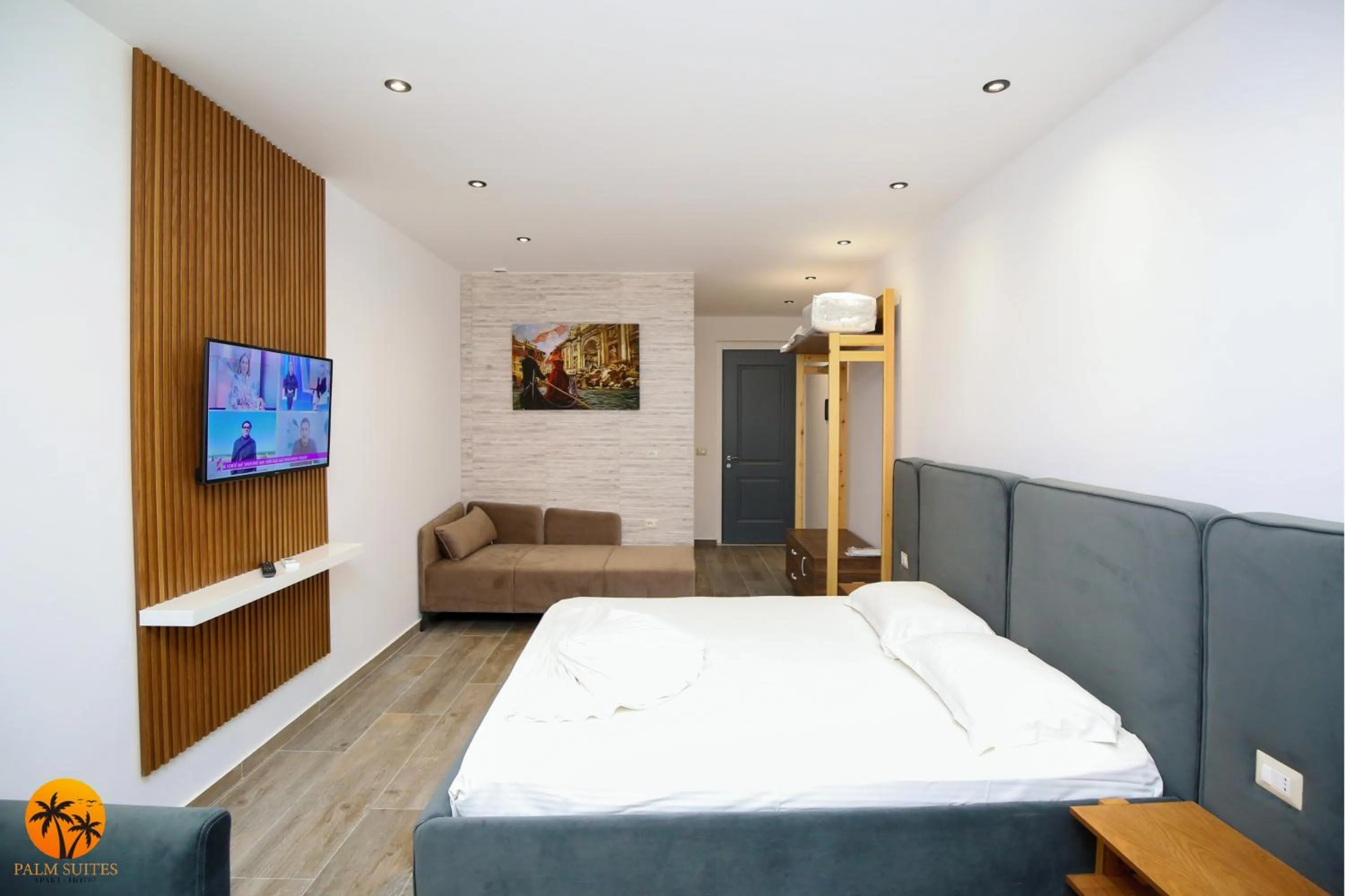 Bed in Palm Suites Apartment-Suite