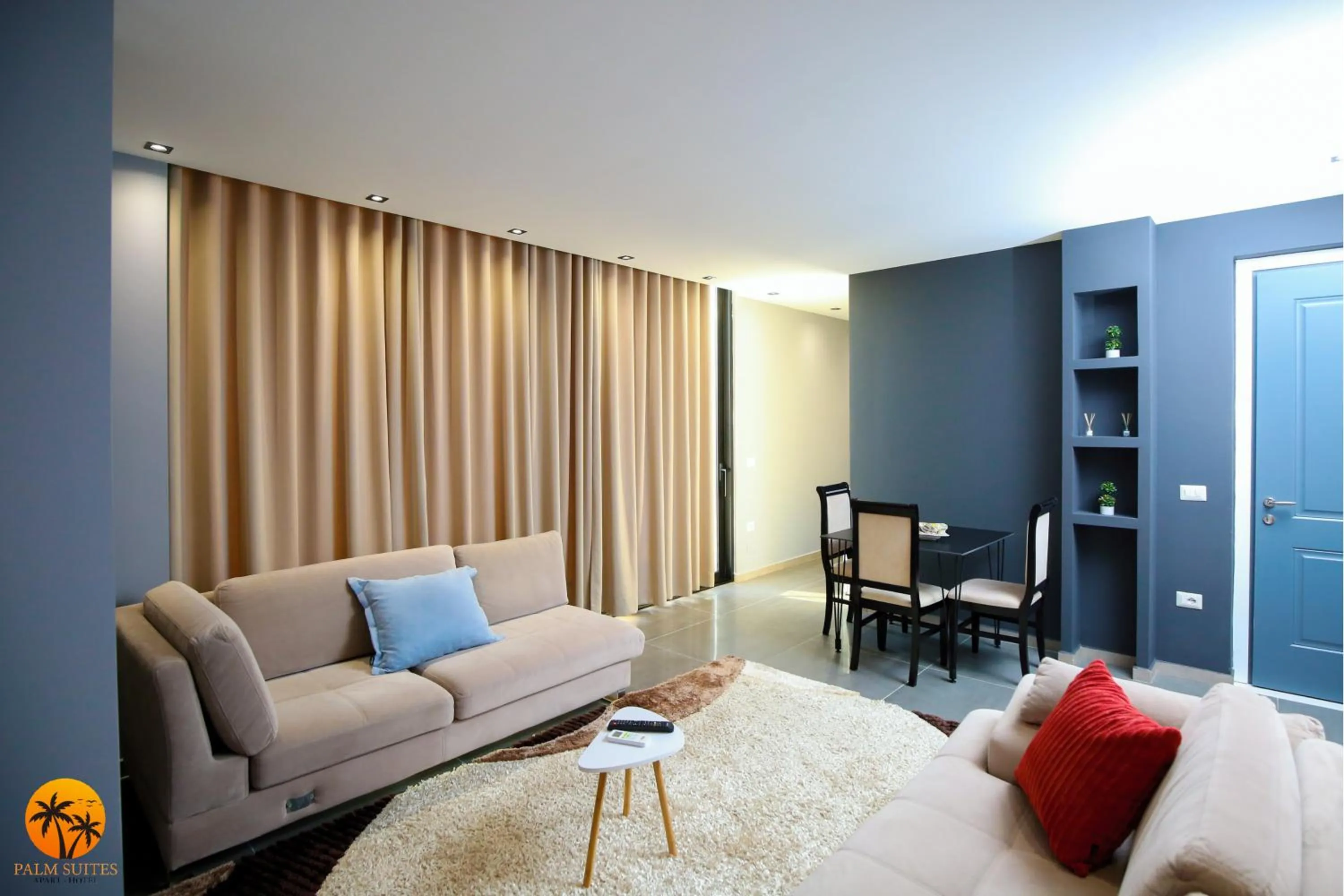 Communal lounge/ TV room in Palm Suites Apartment-Suite