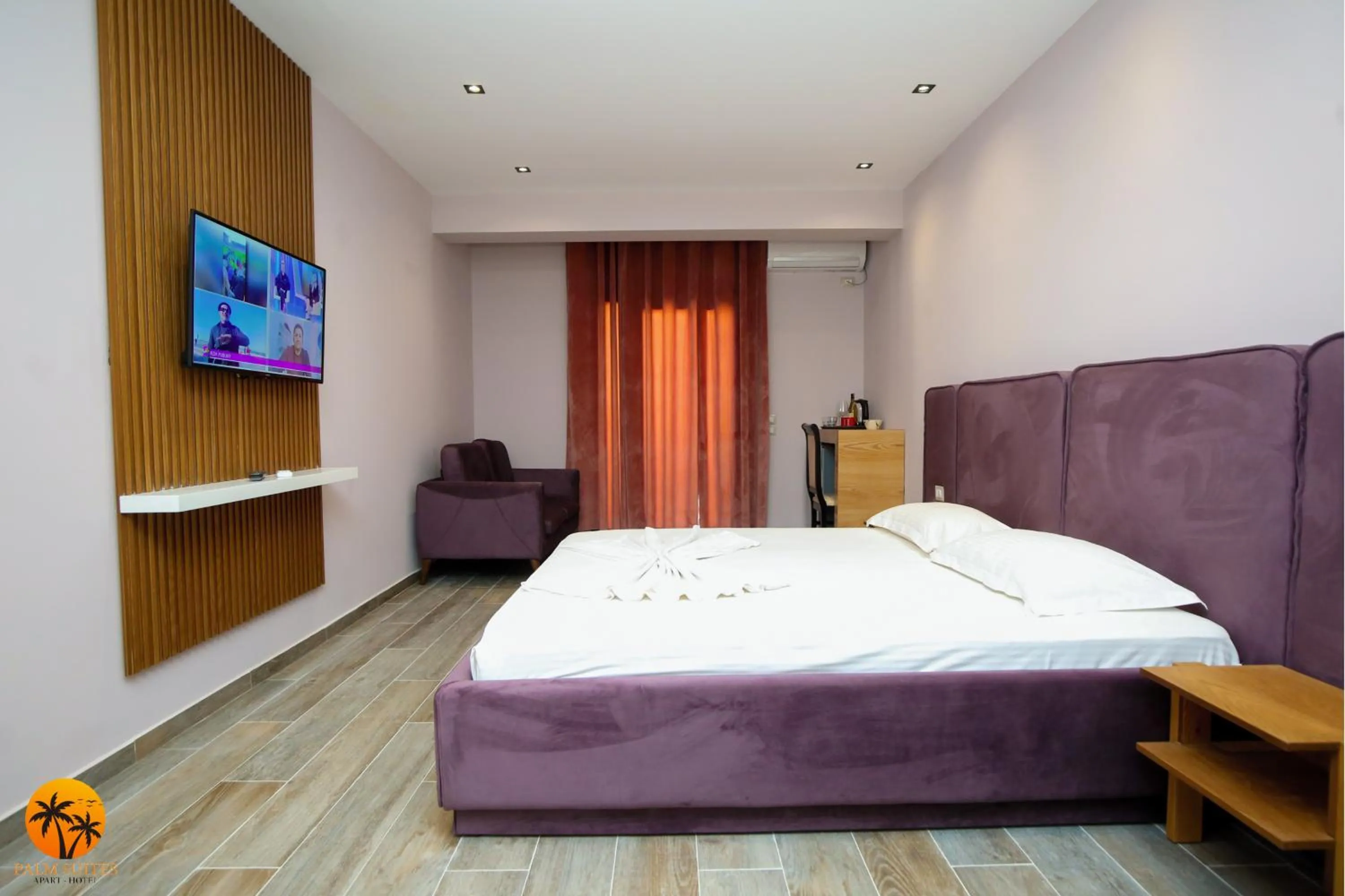 Bed in Palm Suites Apartment-Suite