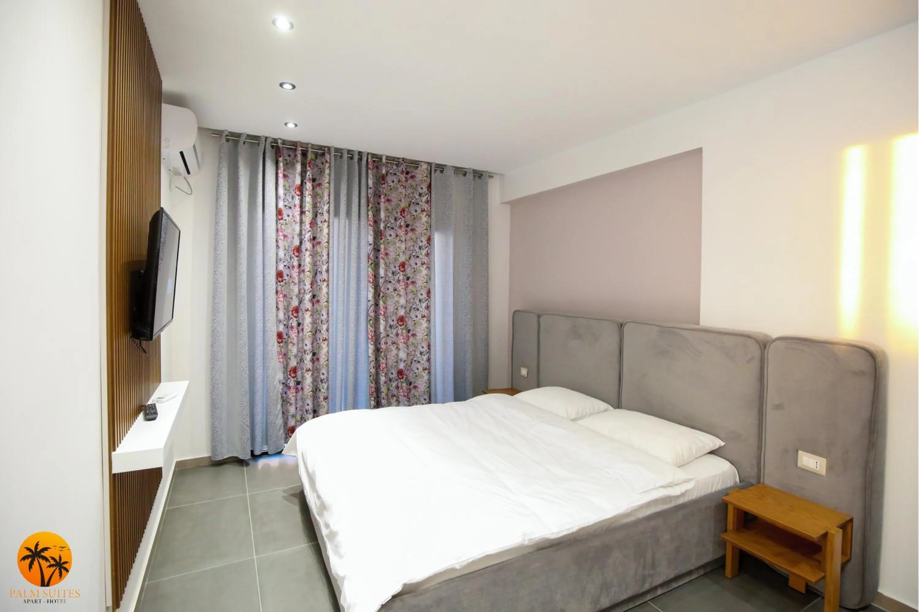 Bed in Palm Suites Apartment-Suite