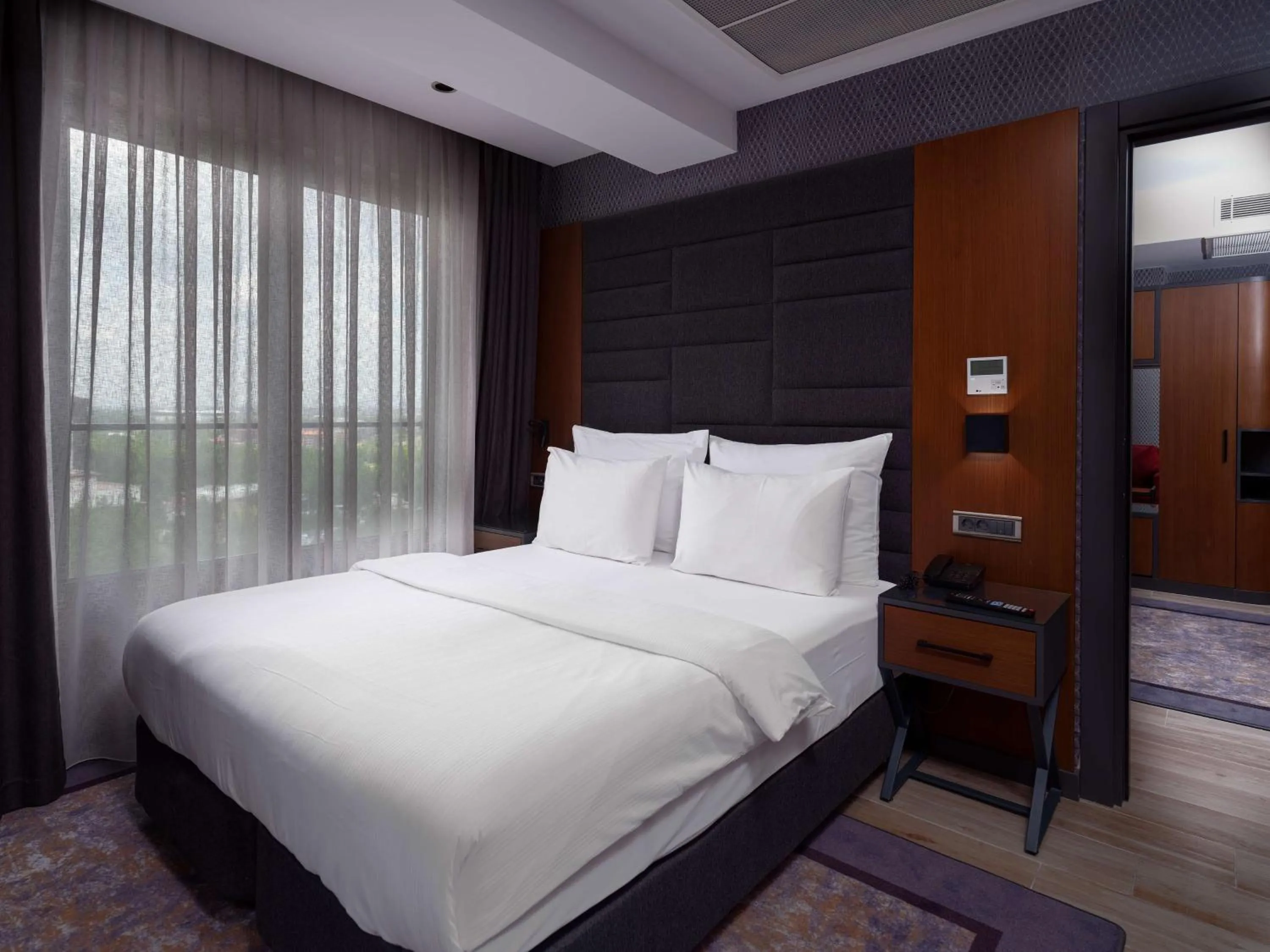 Photo of the whole room, Bed in Nova Vista Deluxe & Suites a Member of Radisson Individuals