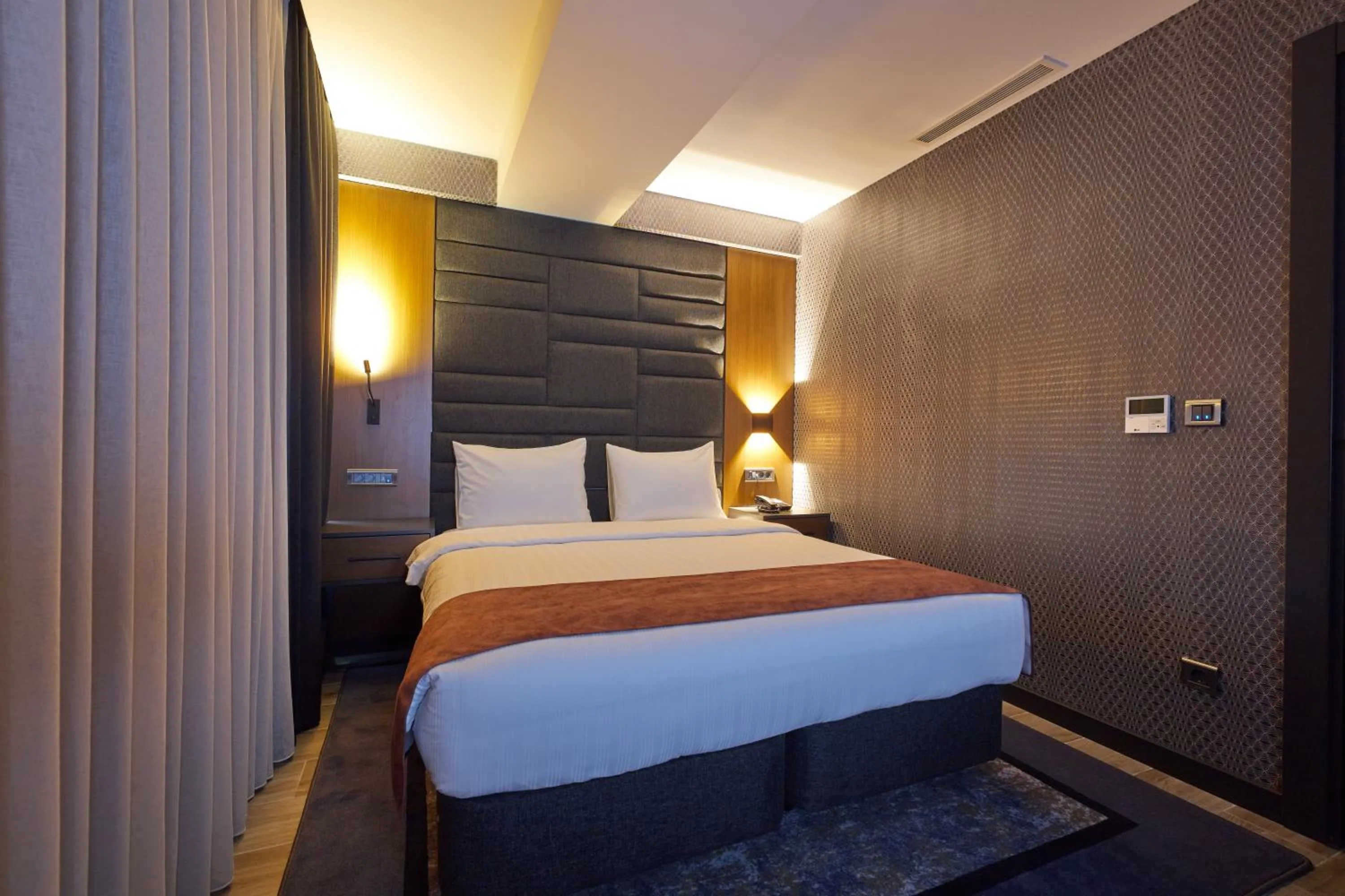 Bed in Nova Vista Deluxe & Suites a Member of Radisson Individuals