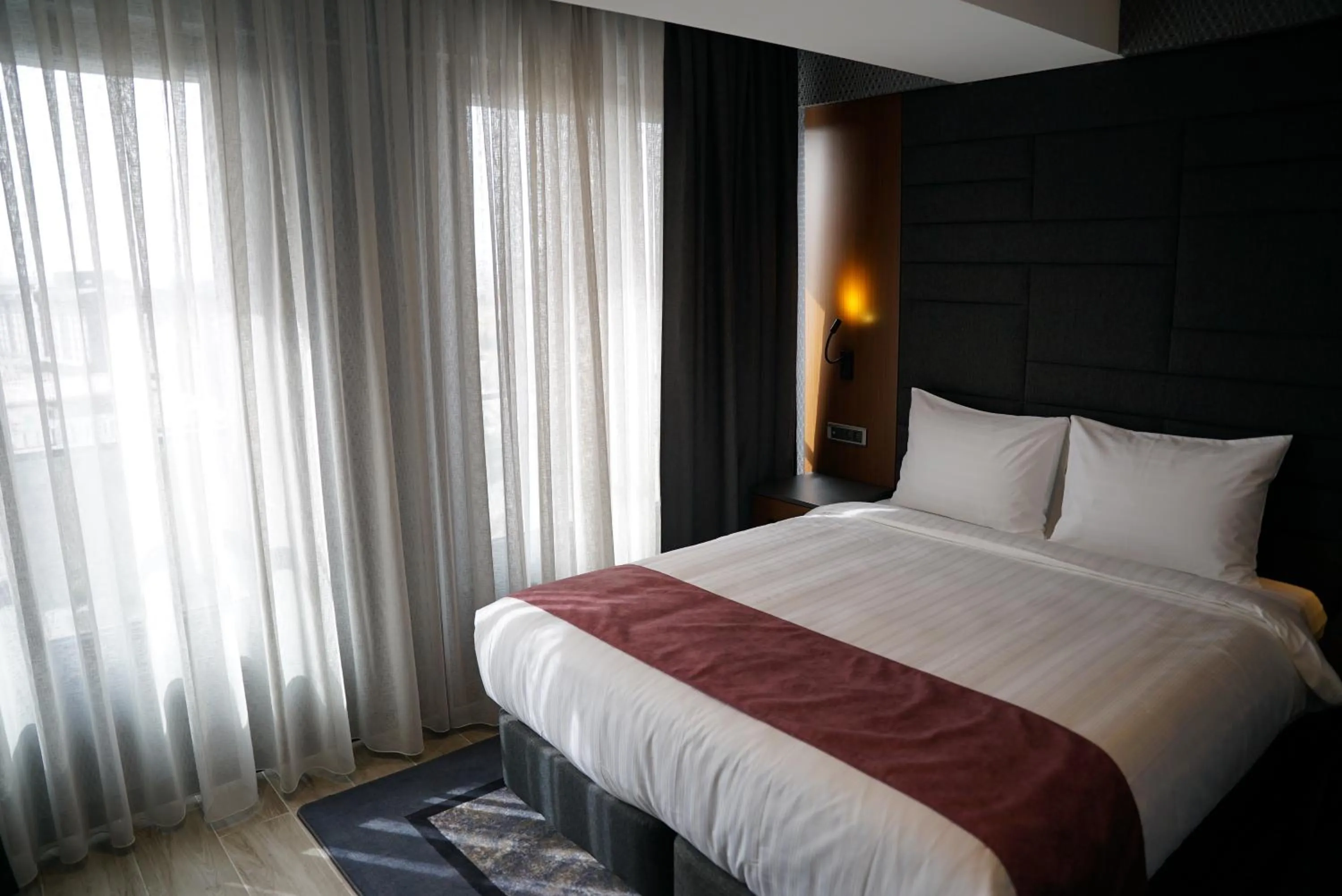 Bed in Nova Vista Deluxe & Suites a Member of Radisson Individuals