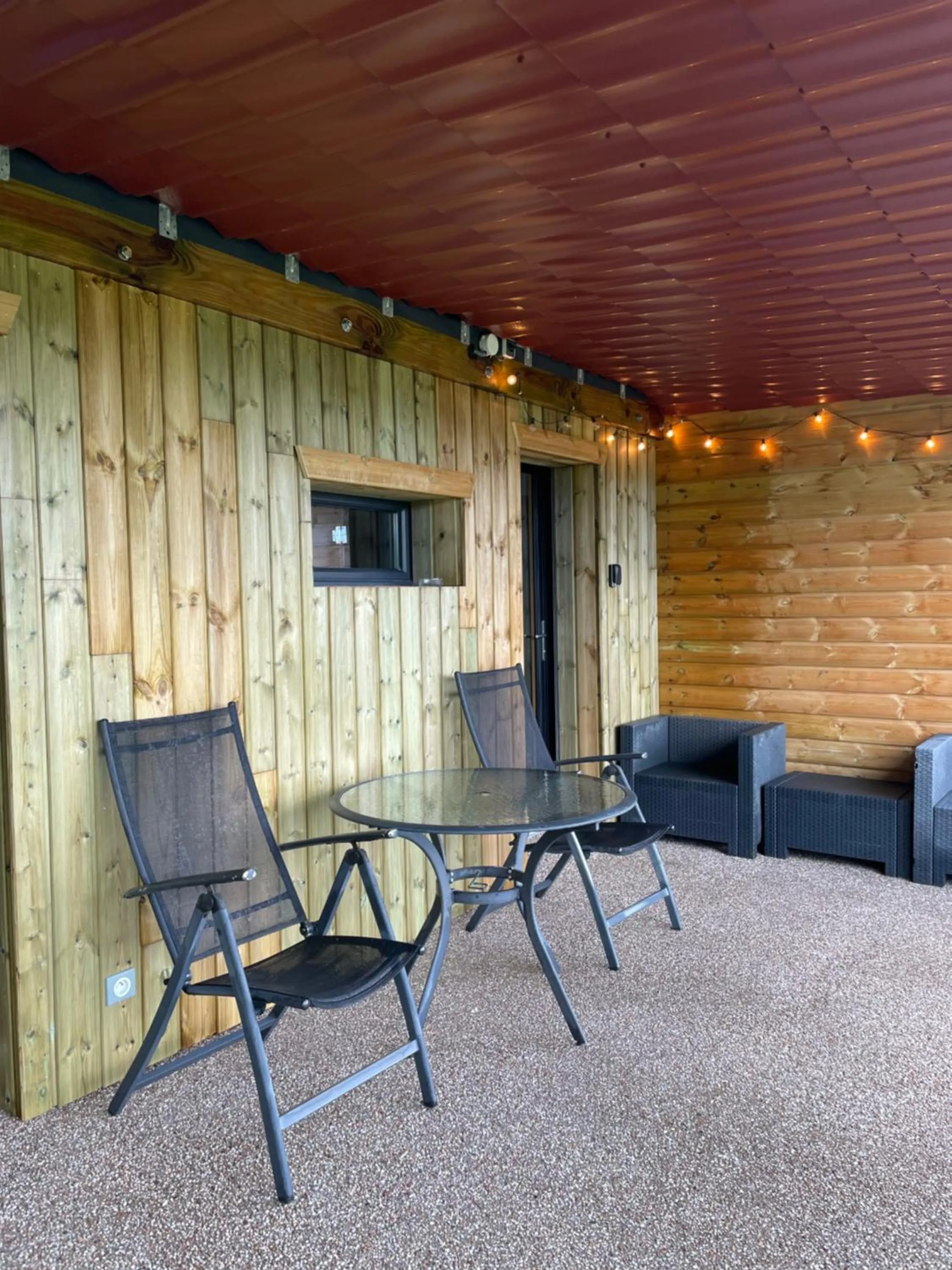 Patio in Le gîte cozy de Bouvacôte avec vue panoramique et Sauna