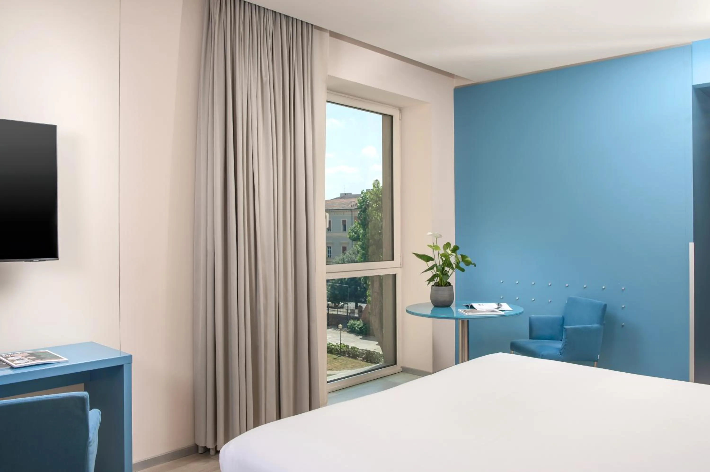 Bedroom, Bed in UNA Hotels Bologna Centro