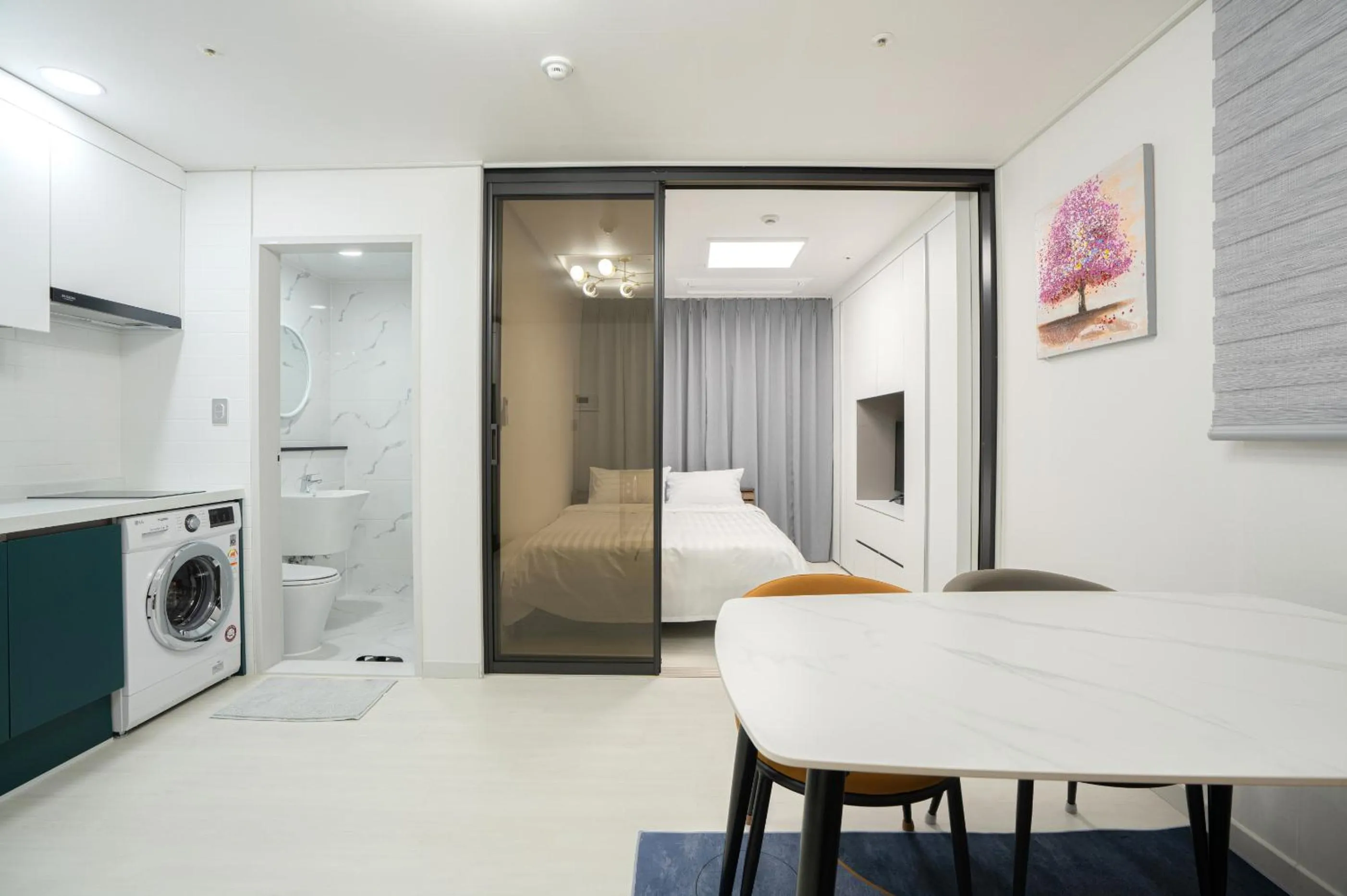 Bed in Jeju Seomun Residence Hotel