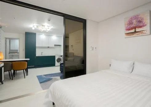 Bed in Jeju Seomun Residence Hotel