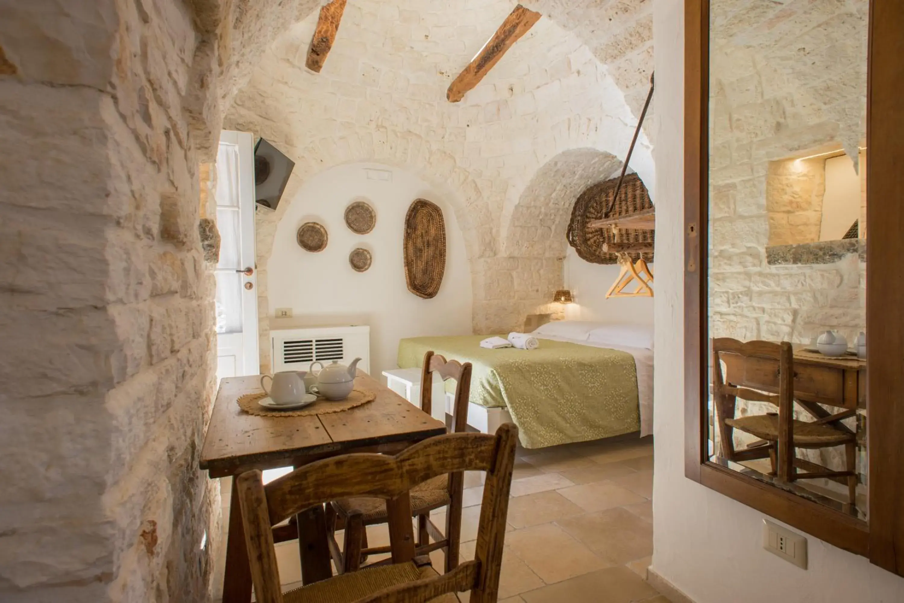 Photo of the whole room, Bed in Trulli Holiday Albergo Diffuso Photo of the whole room, Bed in Trulli Holiday Albergo Diffuso