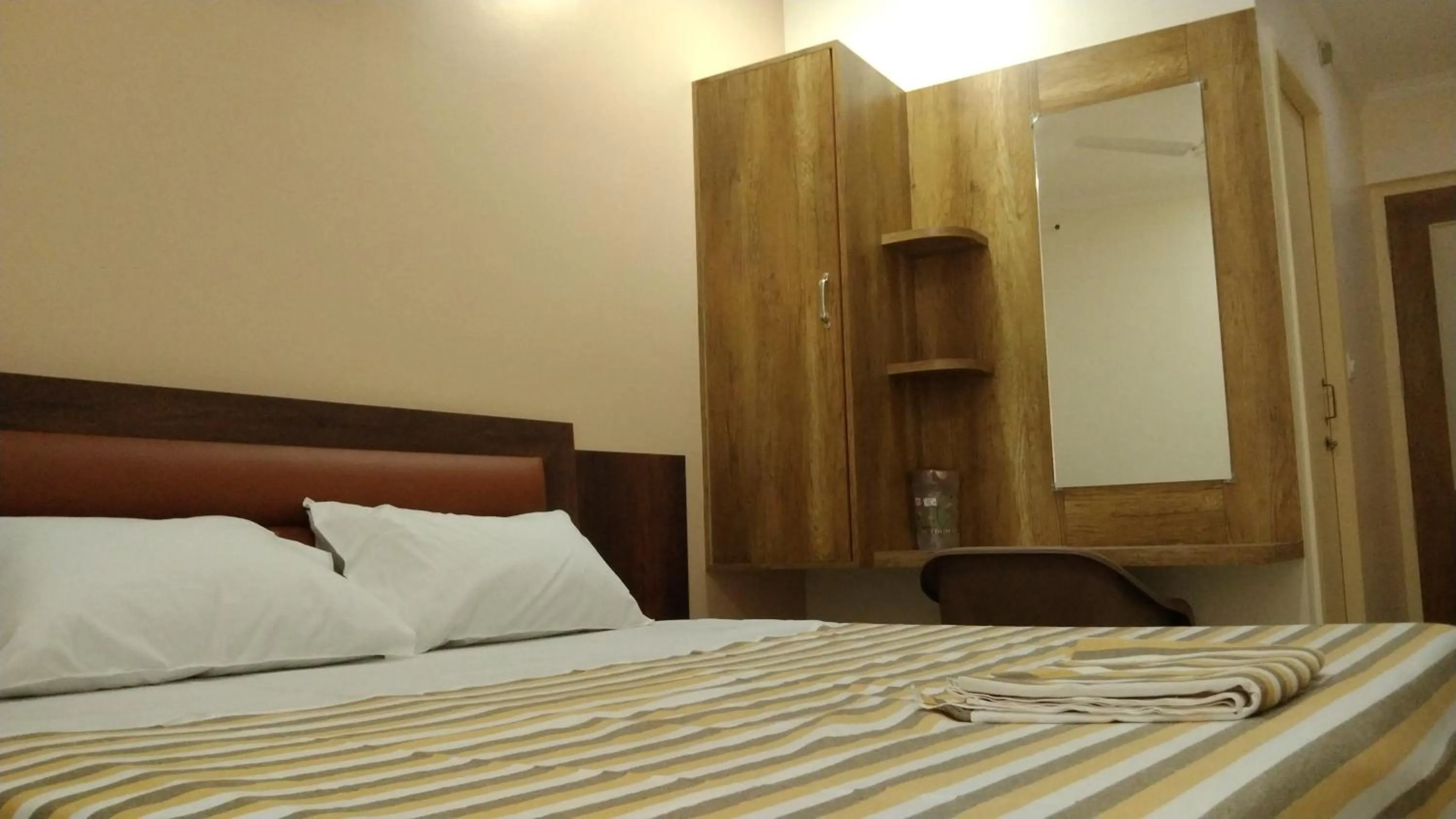 Bed in Hotel Grand Stay