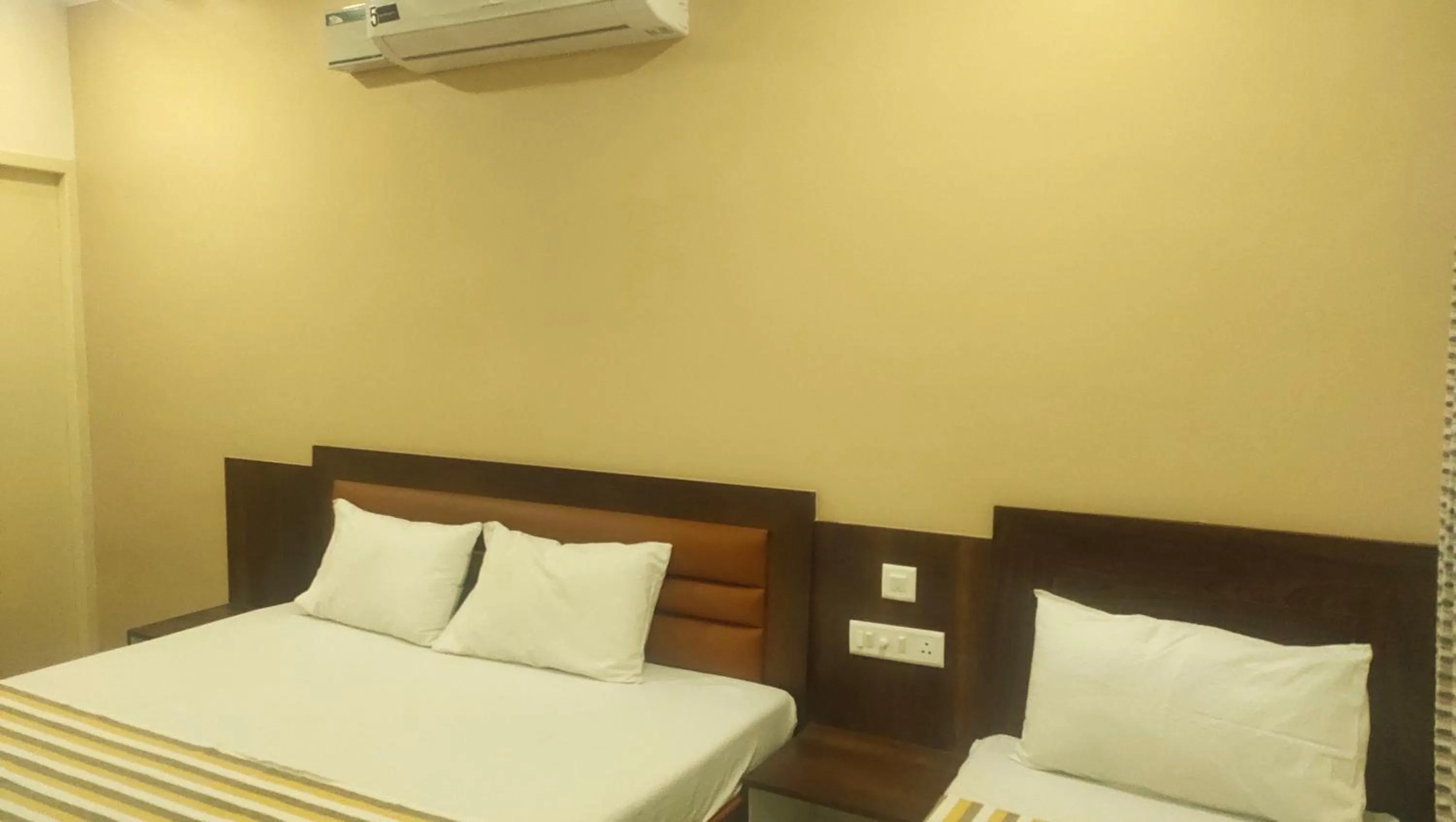 Bed in Hotel Grand Stay