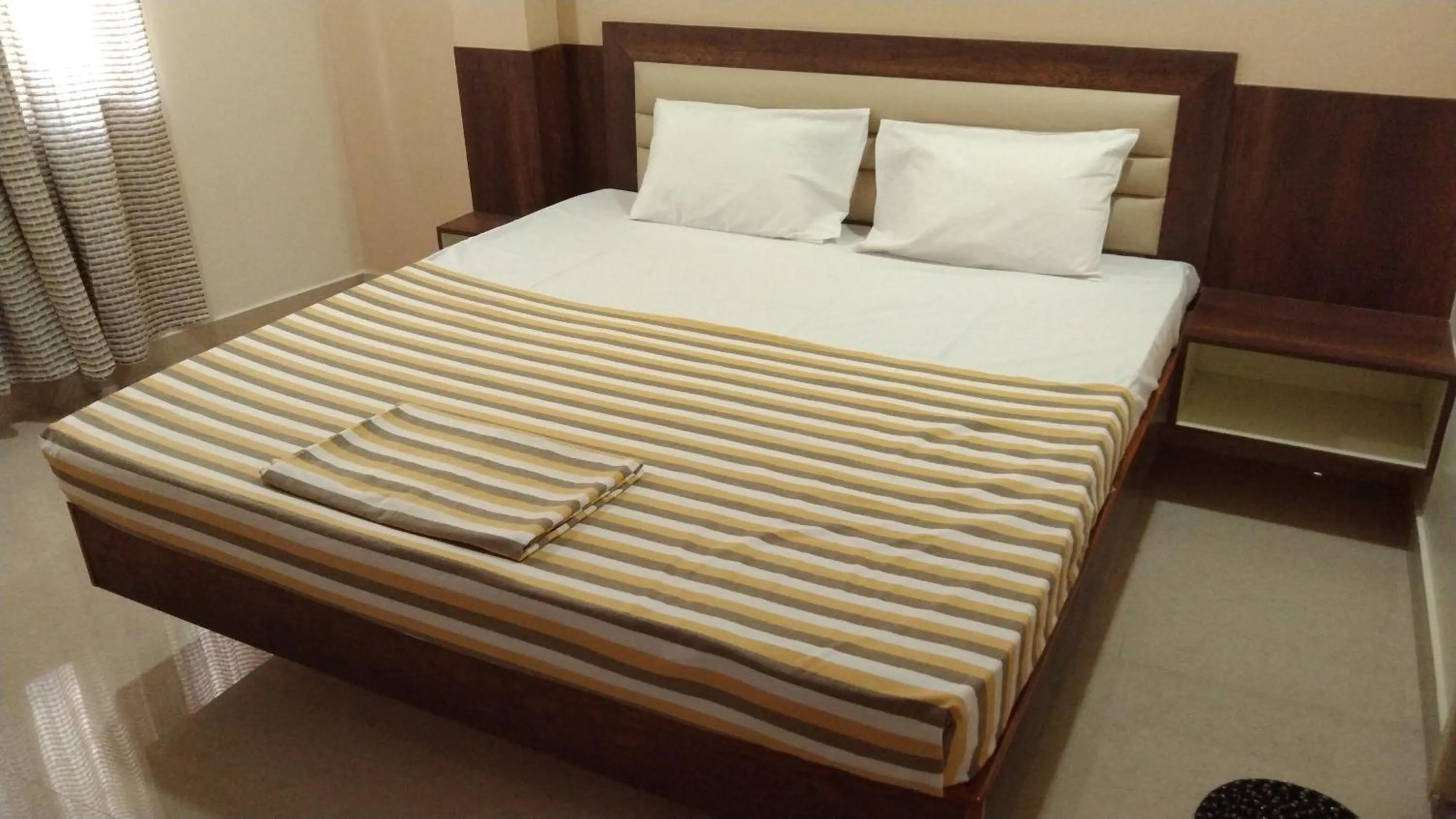Bed in Hotel Grand Stay
