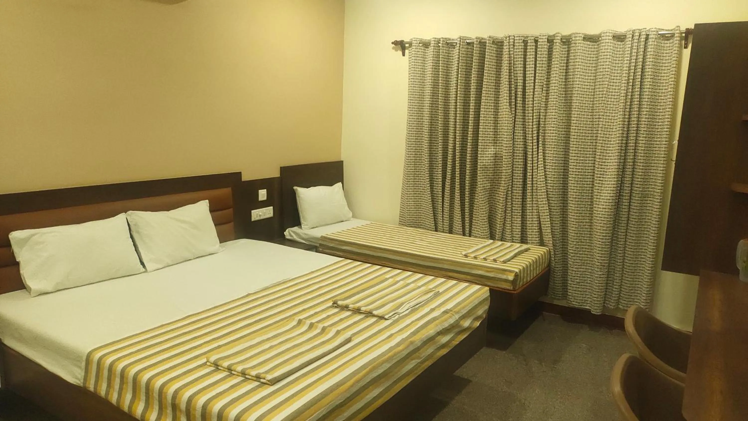 Bed in Hotel Grand Stay