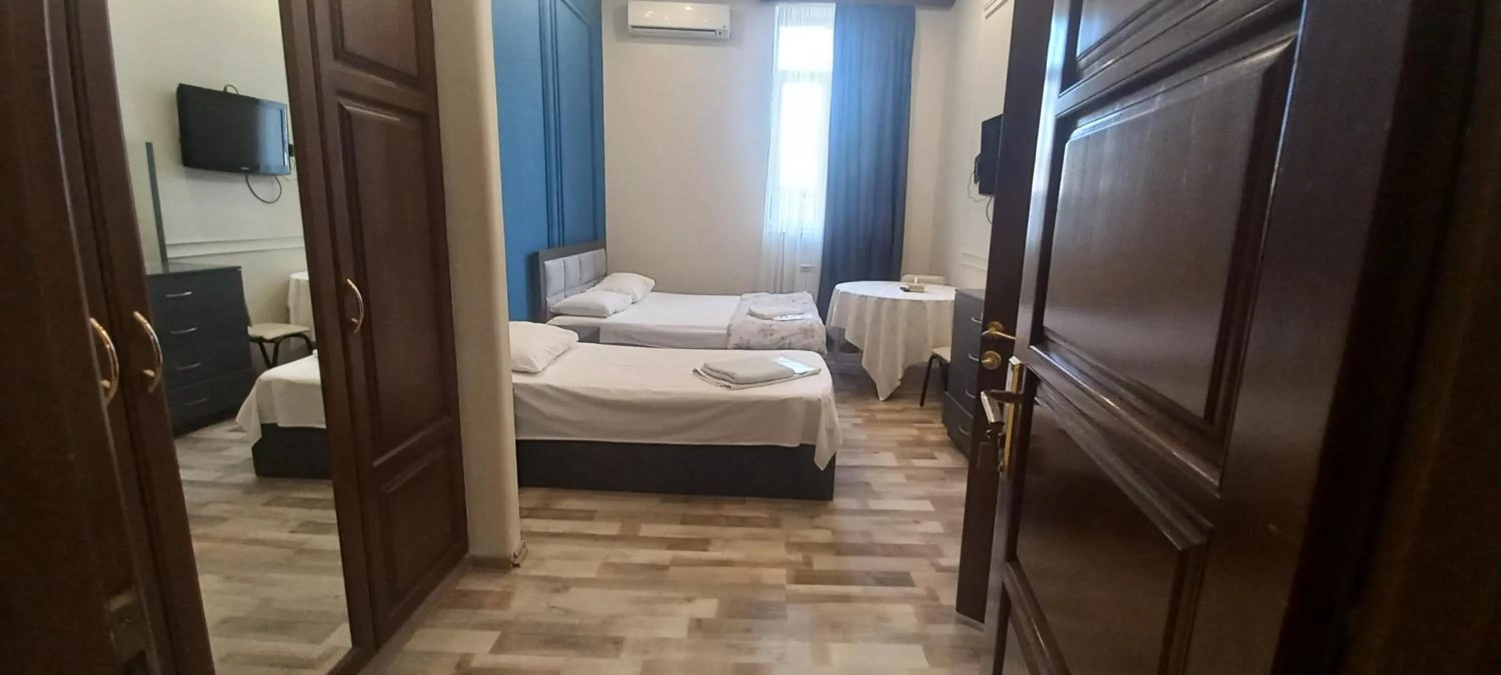 Bed in NEW BELLA HOTEL