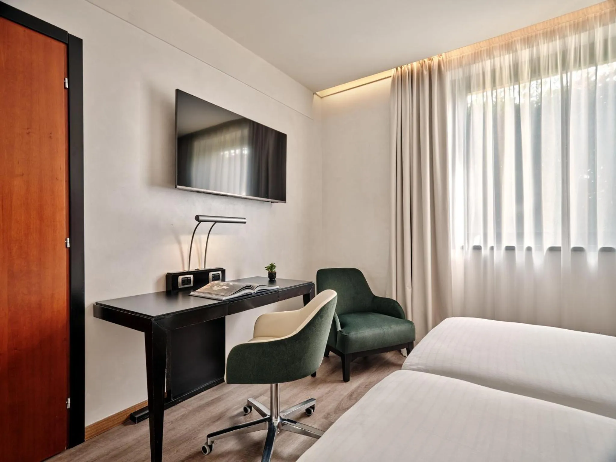 Photo of the whole room, Bed in Crowne Plaza Milan - Malpensa Airport by IHG