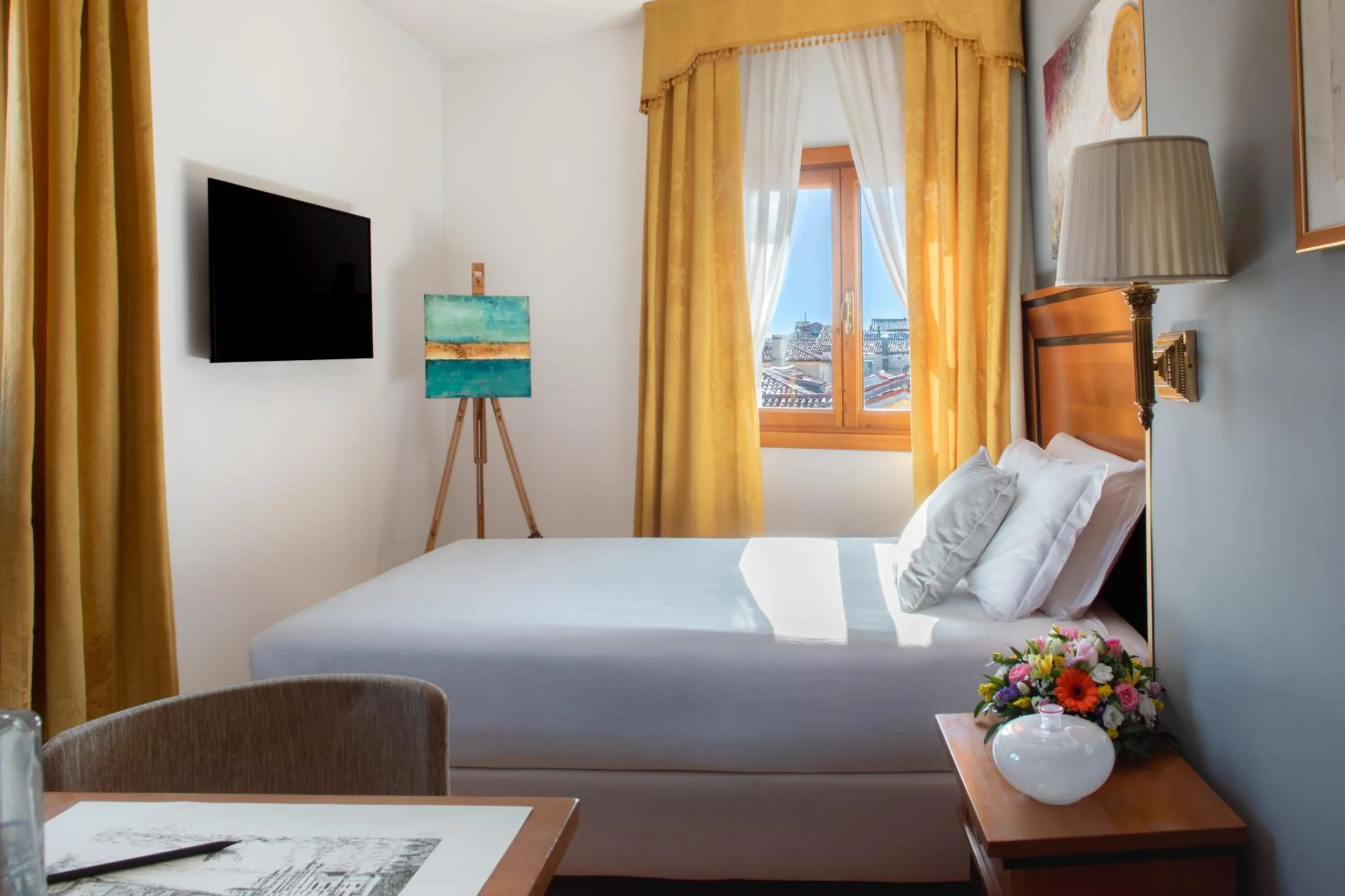 Bed in All’Angelo Art Hotel