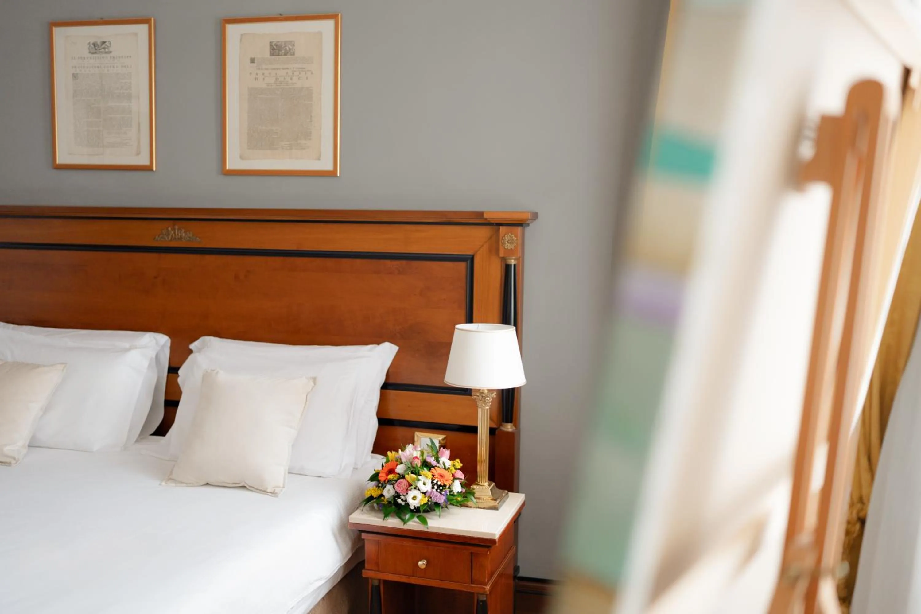 Bed in All’Angelo Art Hotel