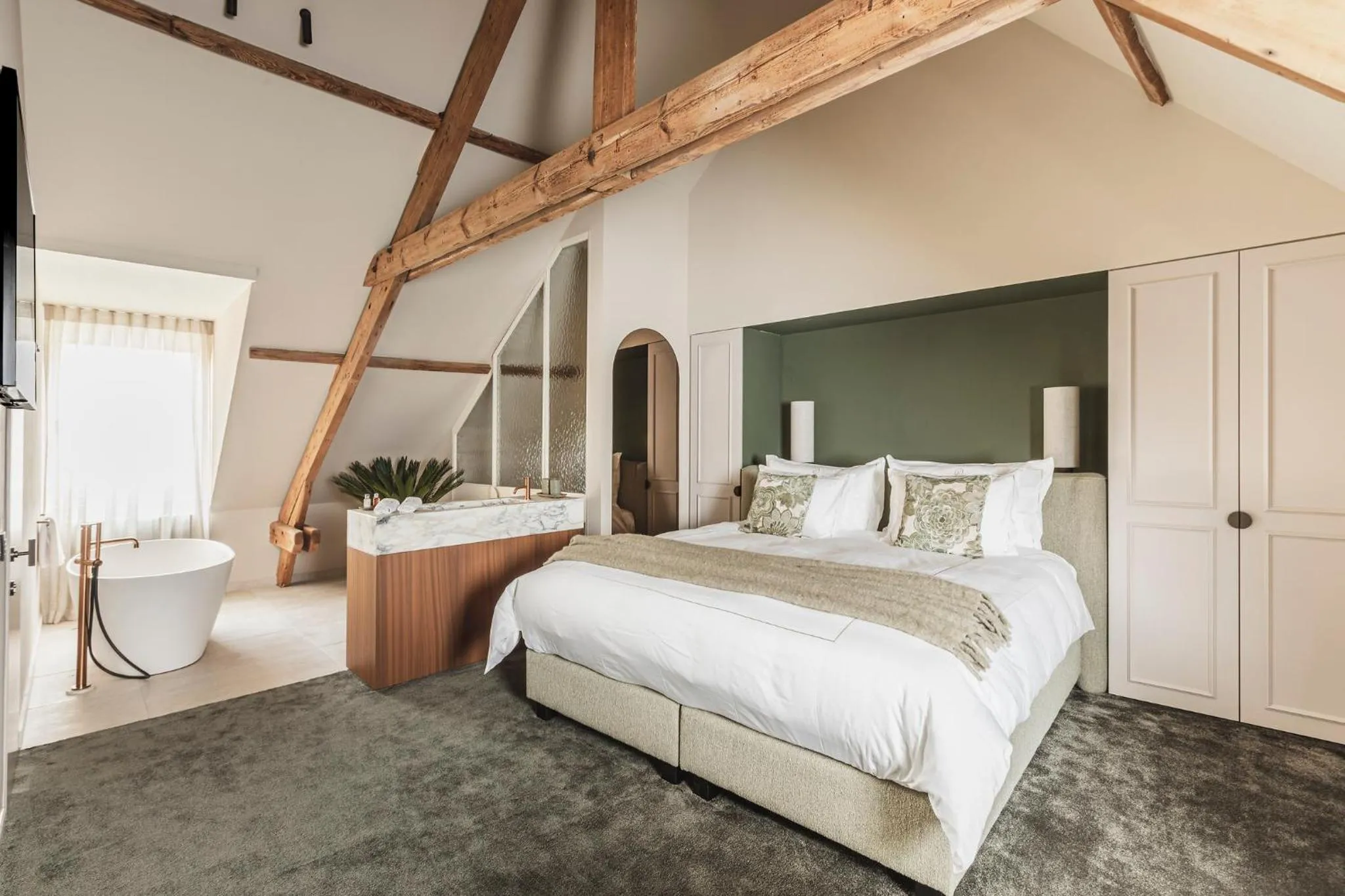 Bed in Raphaëlles Boutique b&b