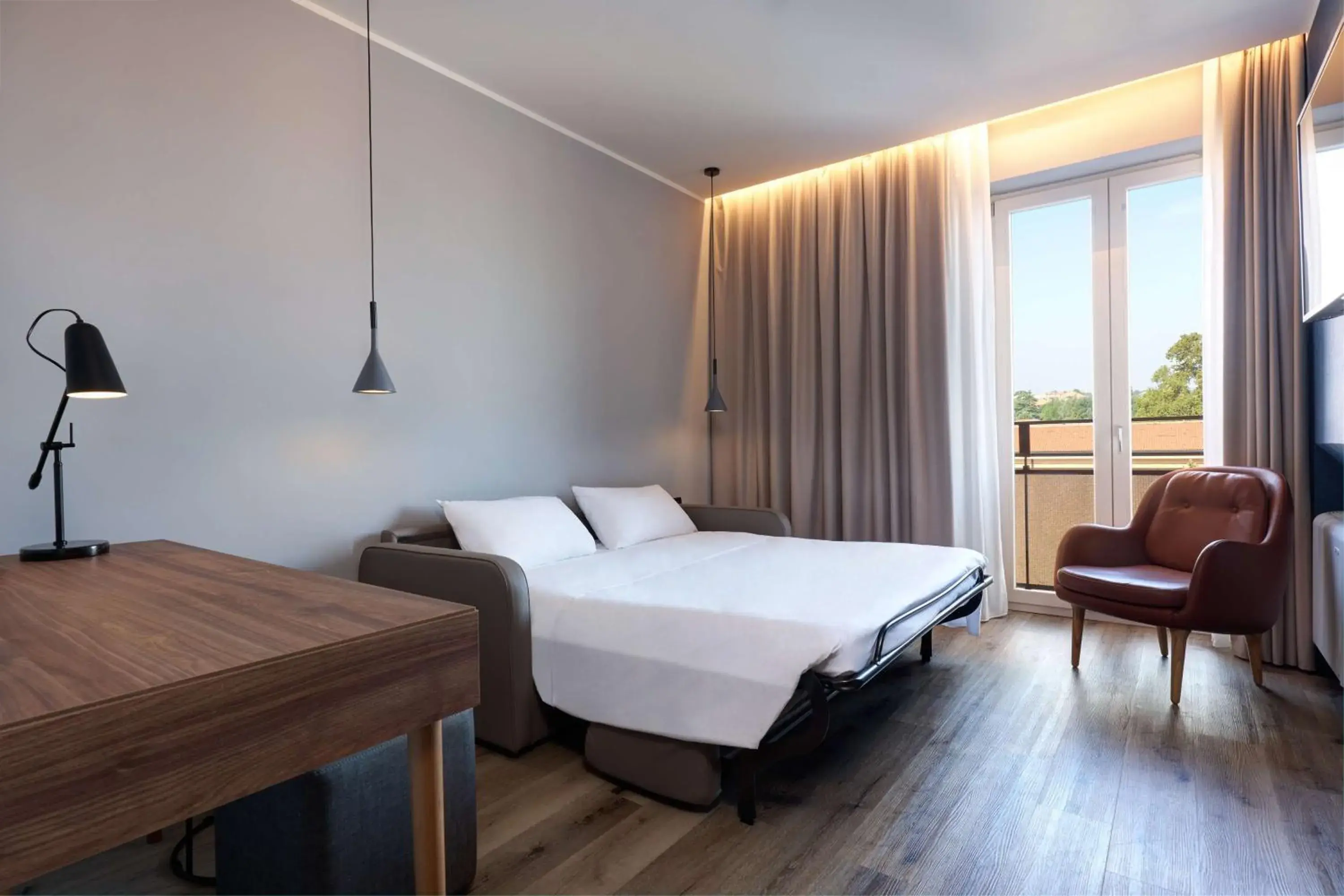 Photo of the whole room, Bed in Radisson Hotel Ferrara Photo of the whole room, Bed in Radisson Hotel Ferrara