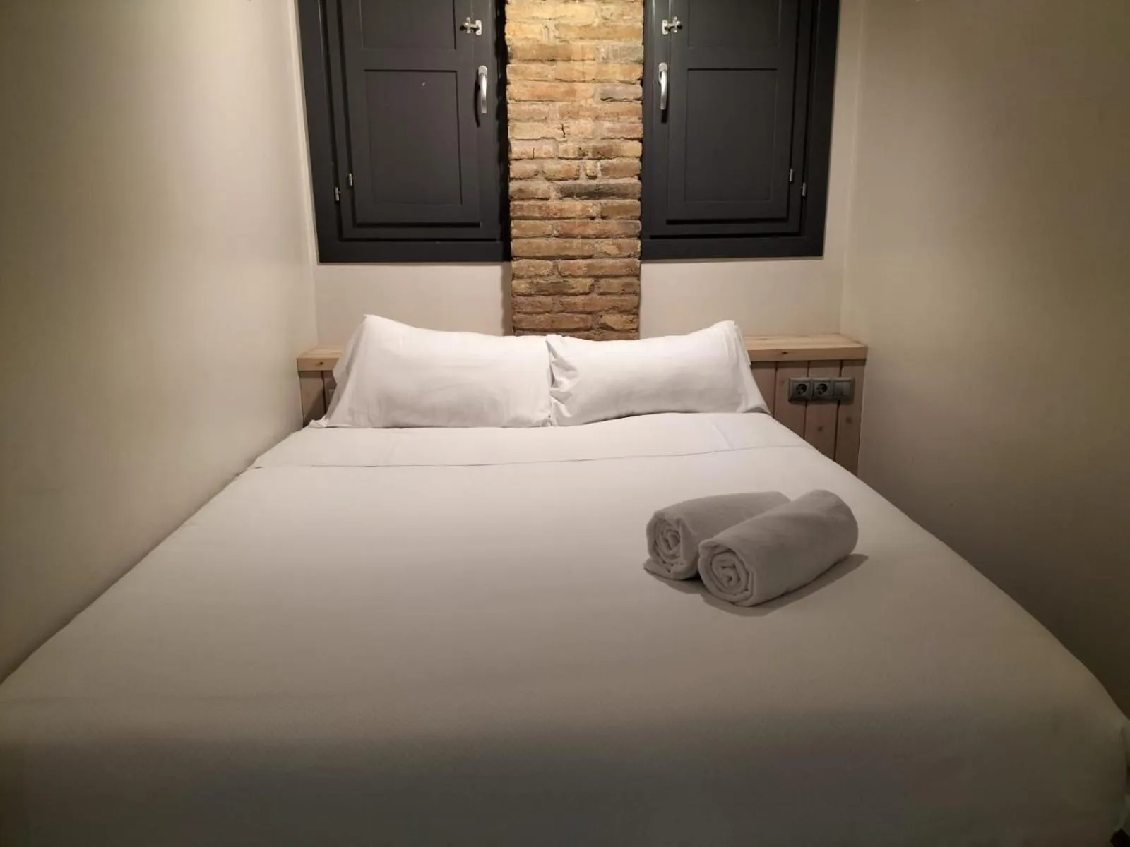 Bed in Montserrat Apartments by gaiarooms